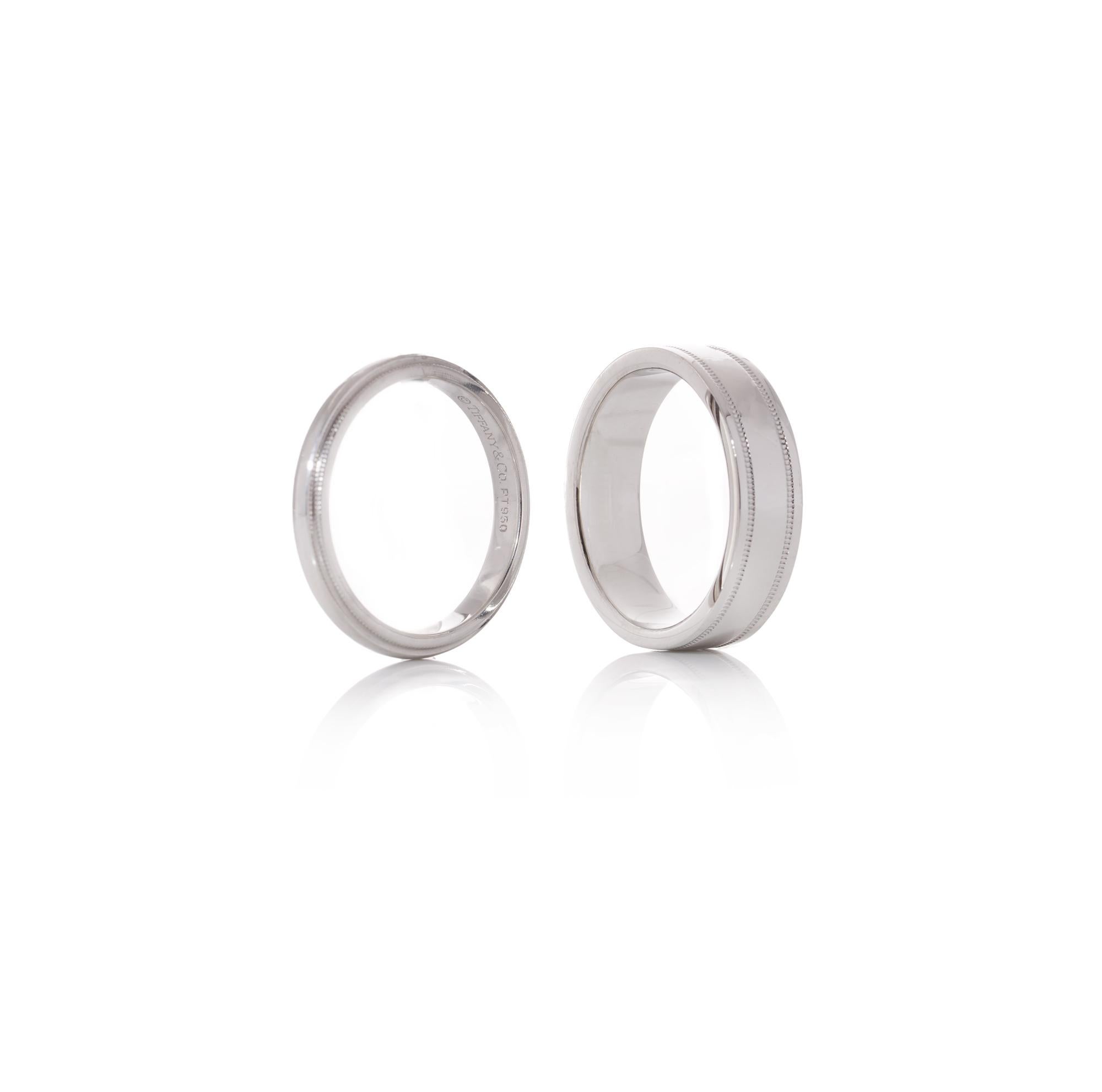 Tiffany & Co. presents a stunning pair of wedding ring bands crafted from 950 platinum, as part of the Tiffany Together collection. These exquisite bands are meticulously hallmarked with the Tiffany & Co. 950 Platinum mark, ensuring their