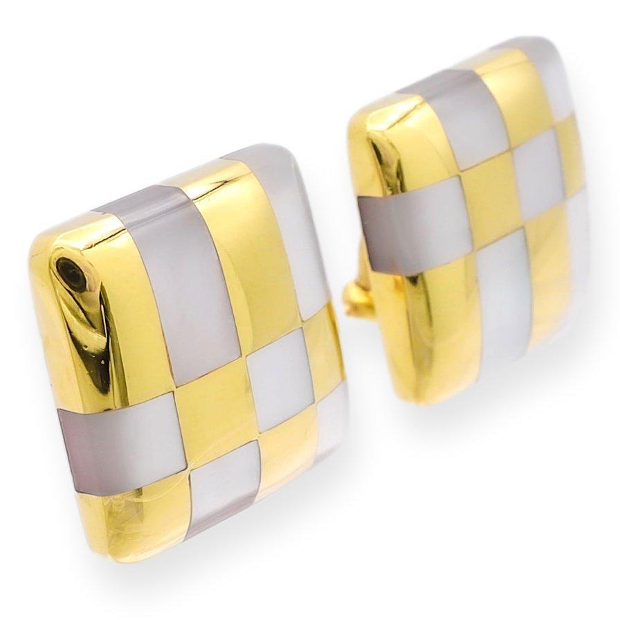 Tiffany & Co. pair of earrings designed by Angela Cummings finely crafted in 18 karat yellow gold featuring 12 embellishments of mother of pearl inlay in a geometric checkerboard  square design featuring large omega clip fastenings. Made in the