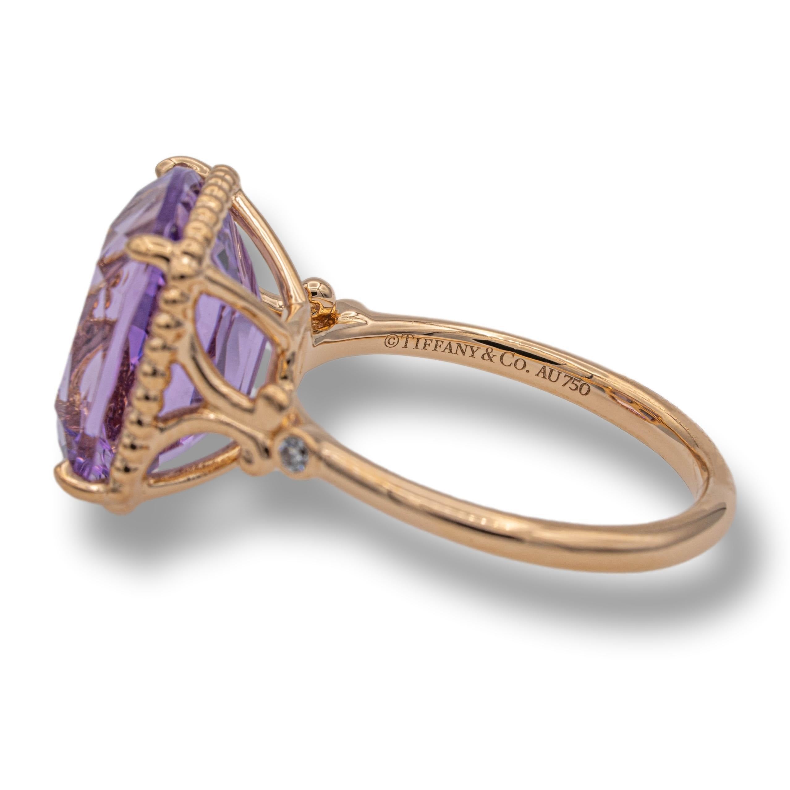 Tiffany & Co. vintage cocktail ring finely crafted in 18 karat rose gold with a center cushion amethyst weighing 6 carats approximately flanked by 2 round brilliant cut diamonds on each side weighing 0.03 carats of diamonds.

Stamp: Tiffany & Co.