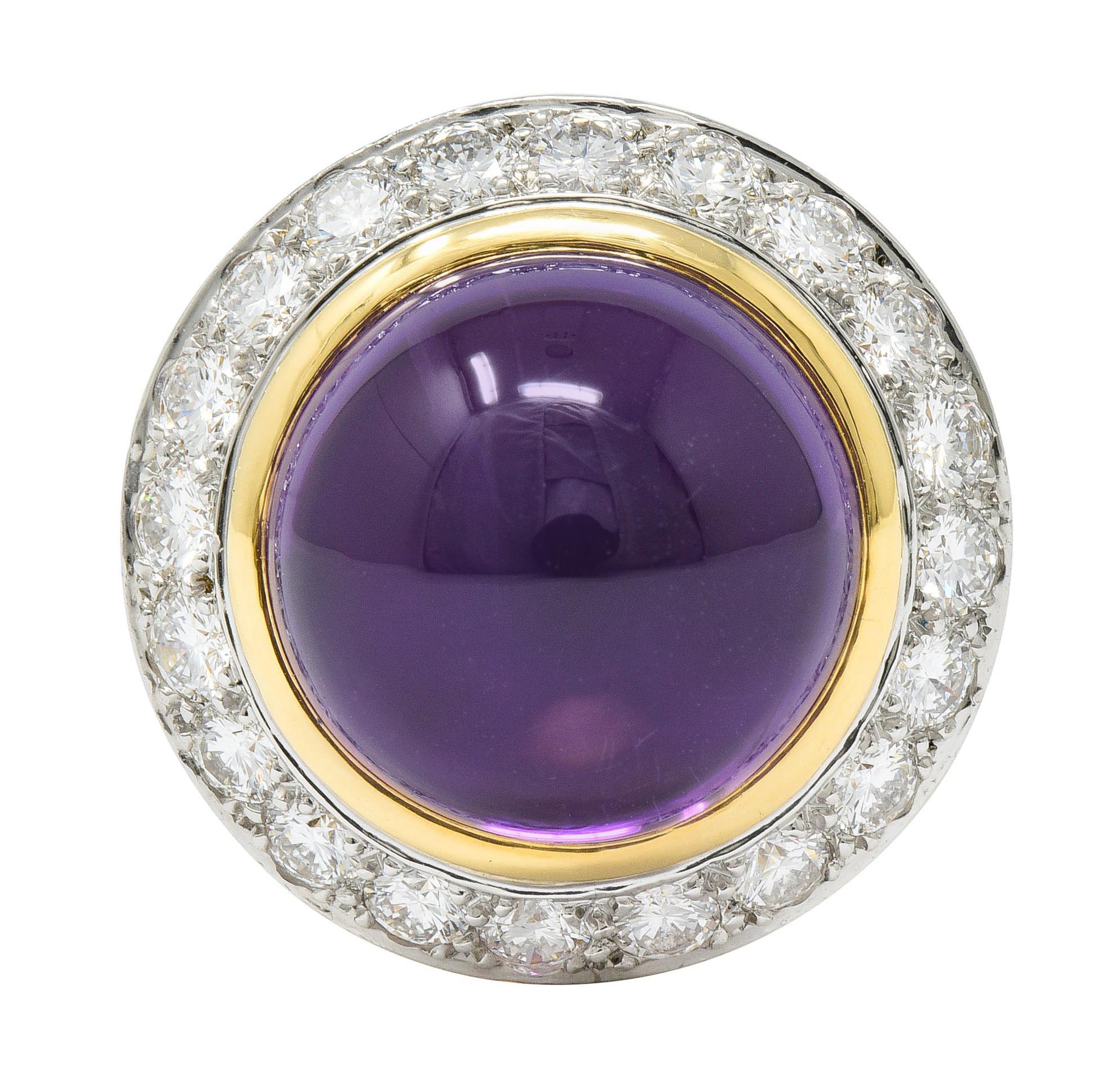 Centering a 14.0 mm round amethyst cabochon; transparent with robust purple color

Surrounded by a halo of round brilliant cut diamonds, bead set in white gold

Total diamond weight is approximately 1.60 carats with F/G color and VS clarity

Tested