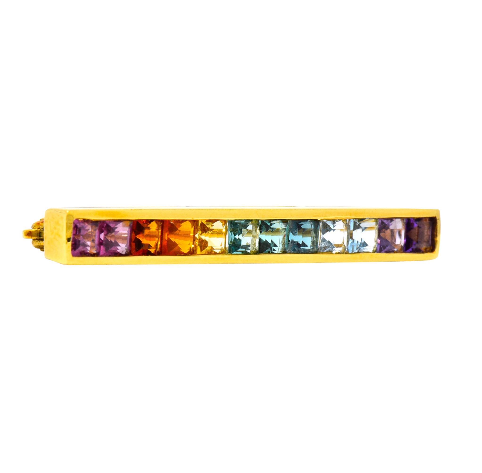 Brooch designed as channel set bar with high polished gold surround

Featuring square cut gemstones of amethyst, aquamarine, citrine, tourmaline, and others

Completed by pin stem and locking closure

Stamped T & Co. and 18k for Tiffany & Co. and 18