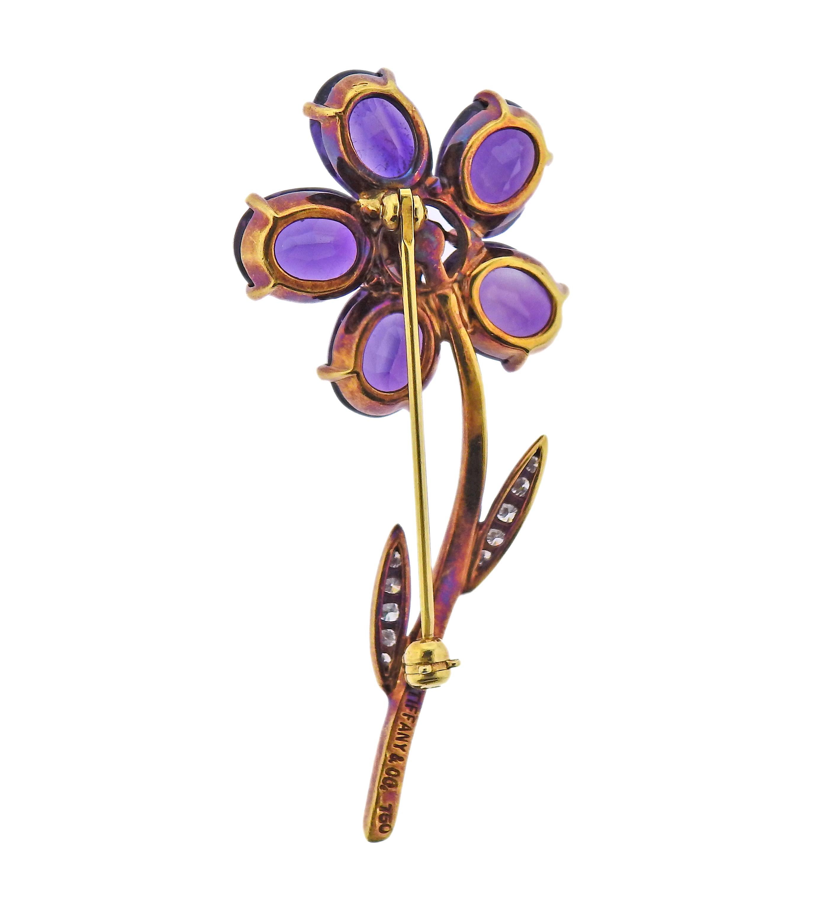 18k gold flower brooch by Tiffany & Co, with amethyst petals and approx. 0.55cts in diamonds. Brooch is 47mm x 24mm. Marked: Tiffany & Co, 750. Weight - 8.4 grams.