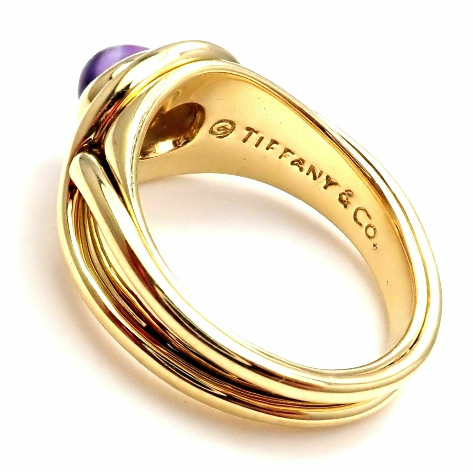 18k Yellow Gold Amethyst Twist Band Ring from Tiffany & Co. 
With 1 oval amethyst stone 5mm x 6.5mm
Measurements: 
Ring Size: 7 (resize available)
Weight:  9.9 grams
Width at Top: 10mm
Stamped Hallmarks: Tiffany & Co 750
*Free Shipping within the