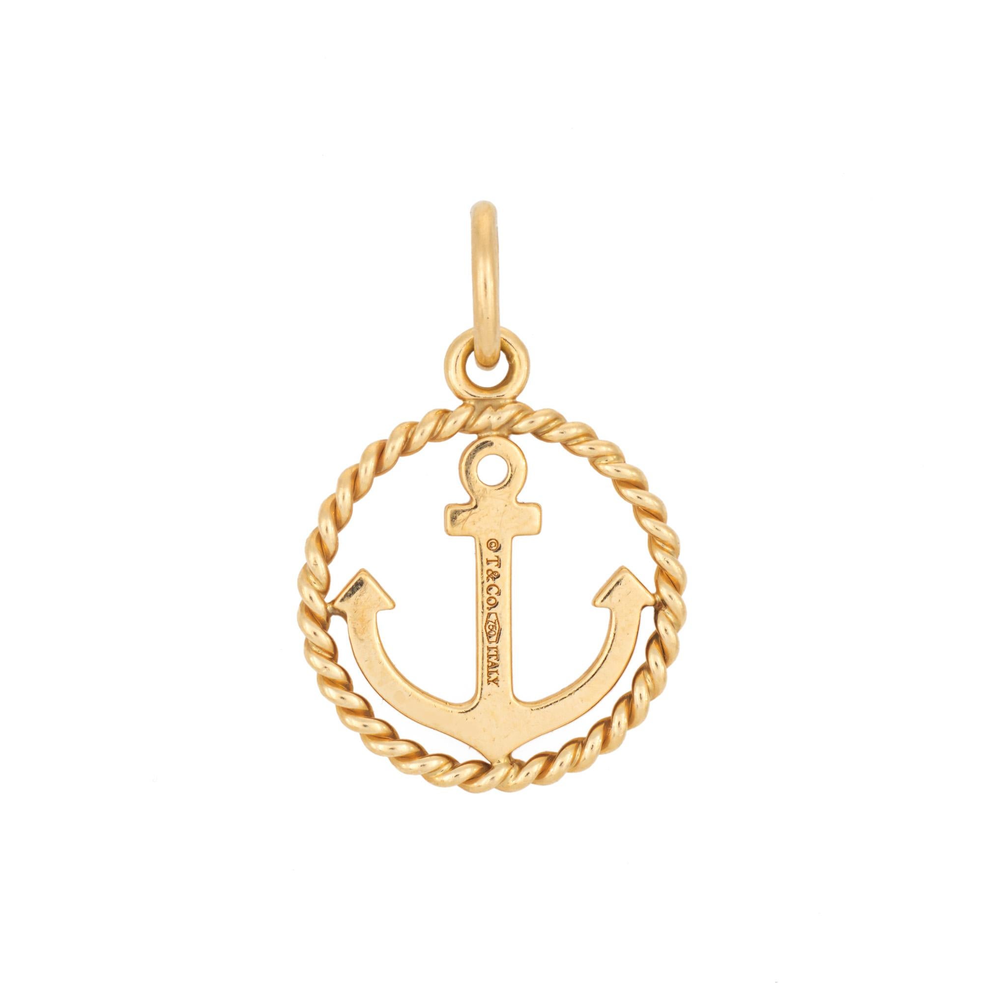 Finely detailed pre-owned Tiffany & Co anchor pendant crafted in 18 karat yellow gold.  

The stylish pendant highlights an anchor framed with a rope design. The piece is ideal worn alone as a pendant or attached to a charm bracelet. 

The pendant