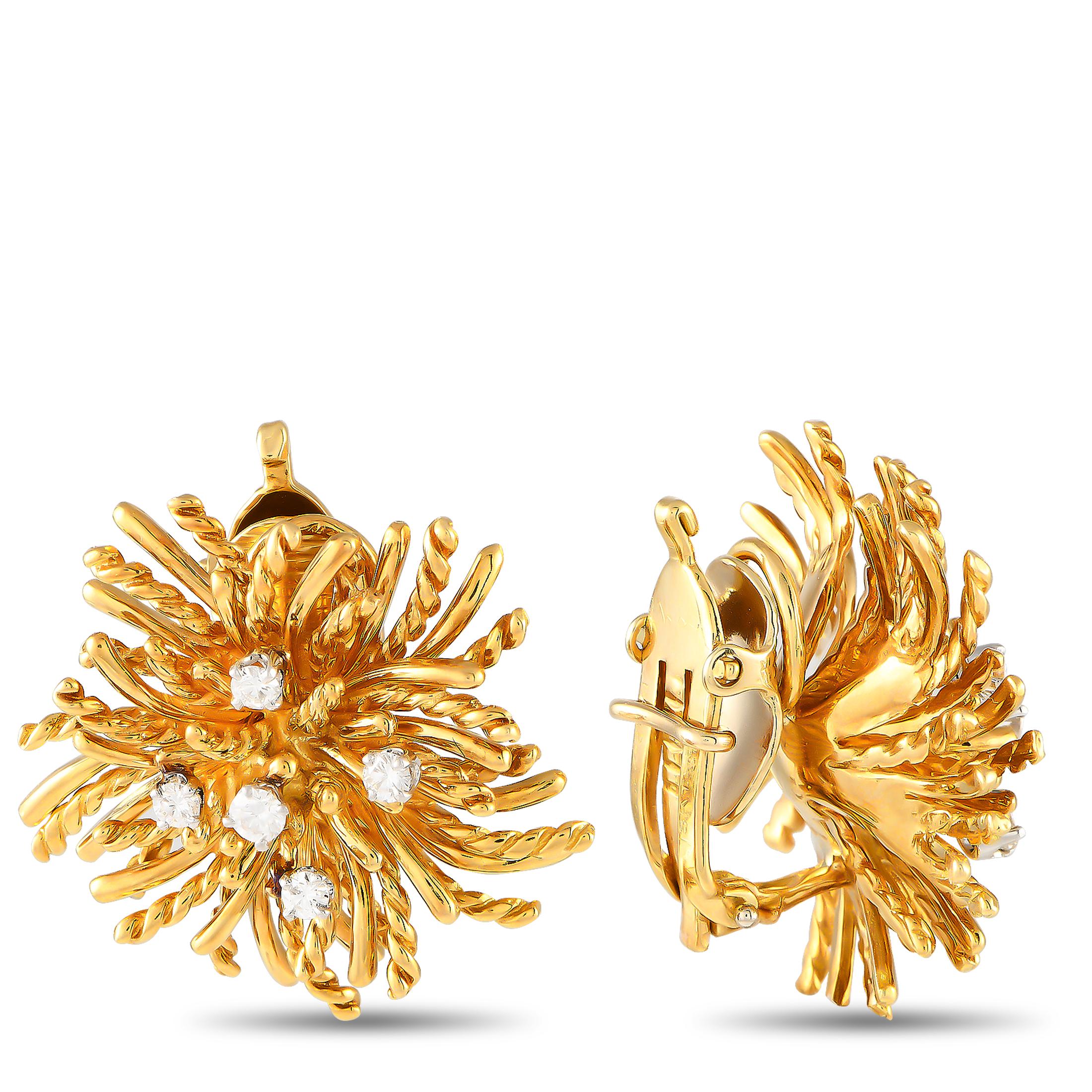 Made by Tiffany & Co., here is a set of earrings and a brooch clad in solid 18K yellow gold. They feature the silhouette of a sea anemone, detailed with polished and grooved tentacles and a diamond-dotted center. The brooch measures 1.5 x 1.5 while