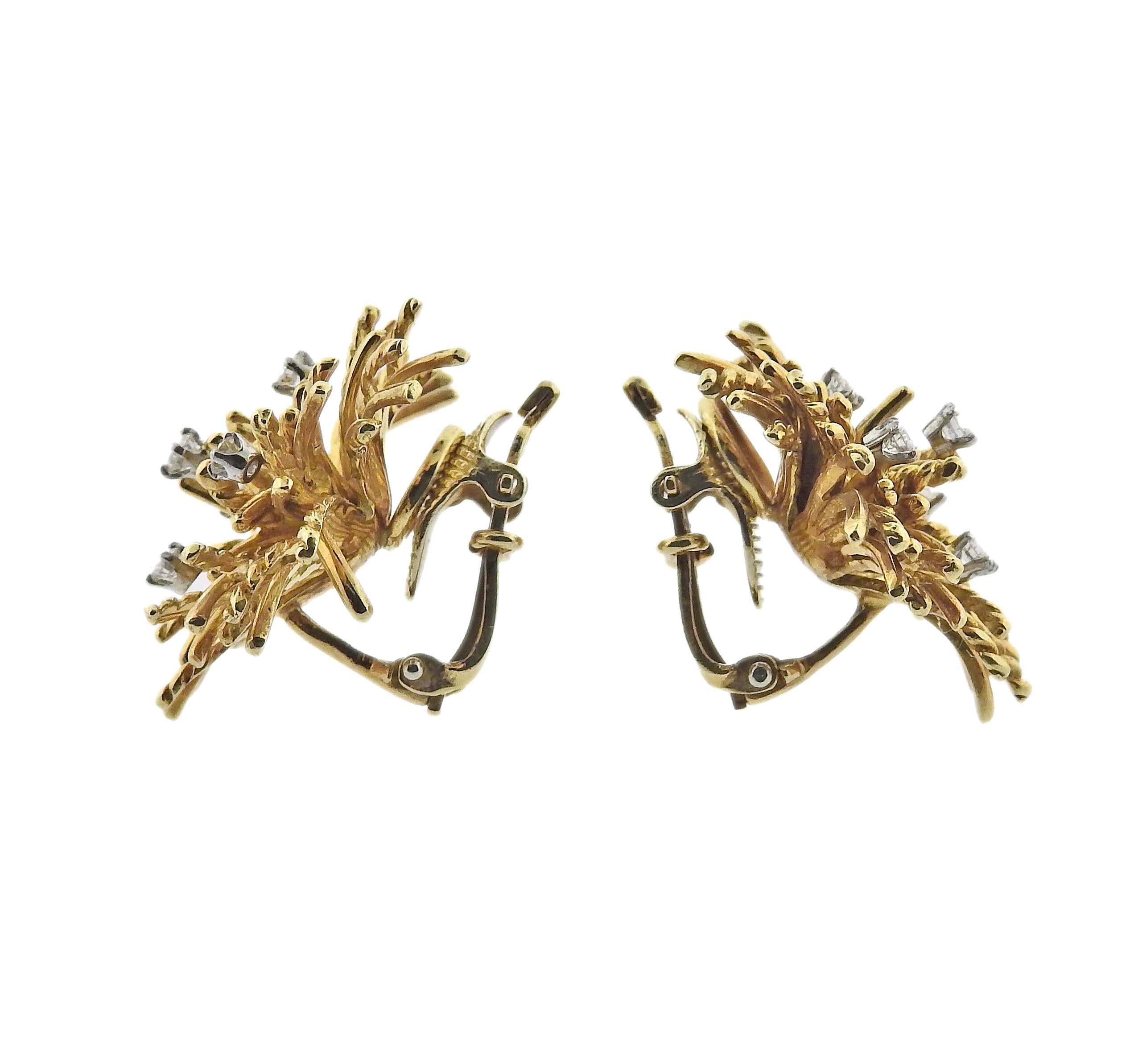 Pair of Tiffany & Co anemone earrings with 0.44ctw in G/VS diamonds. Earrings are 25mm x 26mm. Weight - 20 grams. Marked: Tiffany & Co, 750.  