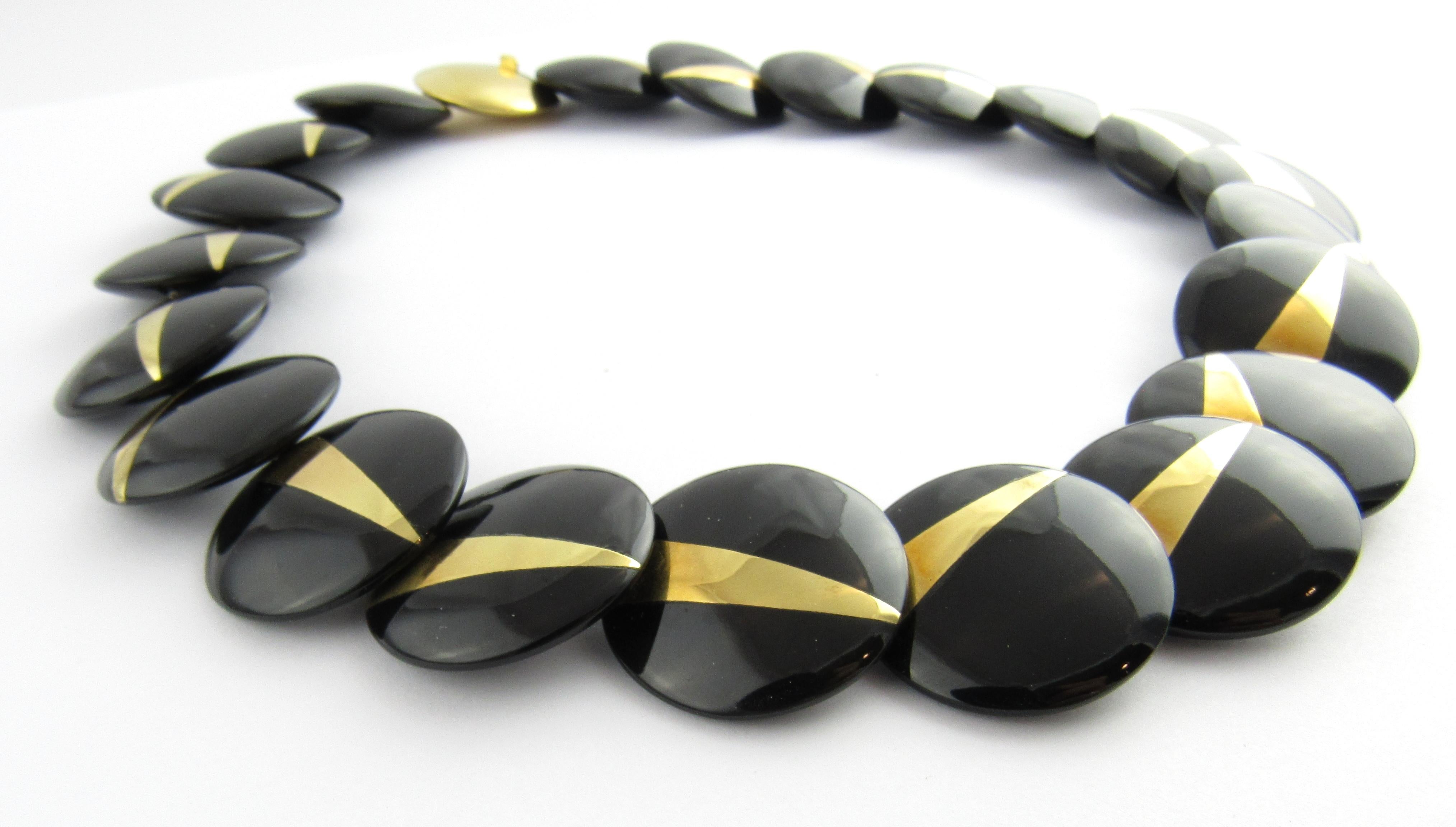 1982 Tiffany & Co. Angela Cummings 18K Yellow Gold and Black Onyx Lentil Disc Necklace

This vintage authentic Tiffany & Co. necklace is approx. 17