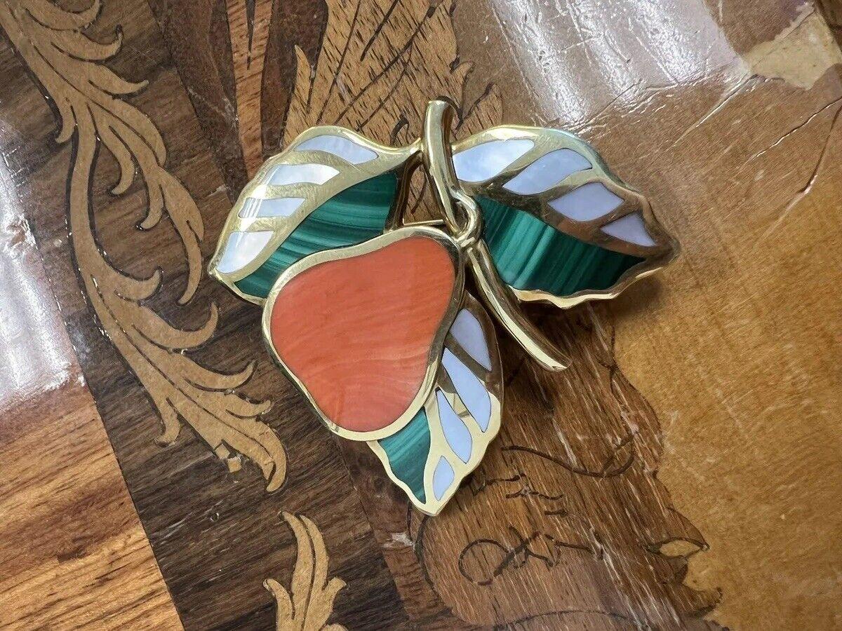 Tiffany & Co. Angela Cummings 18k Yellow Gold, Mother of Pearl, Coral & Malachite Leaf Brooch Vintage

Here is your chance to purchase a beautiful and highly collectible designer brooch.  

The brooch is in excellent condition from the 1980s.  The