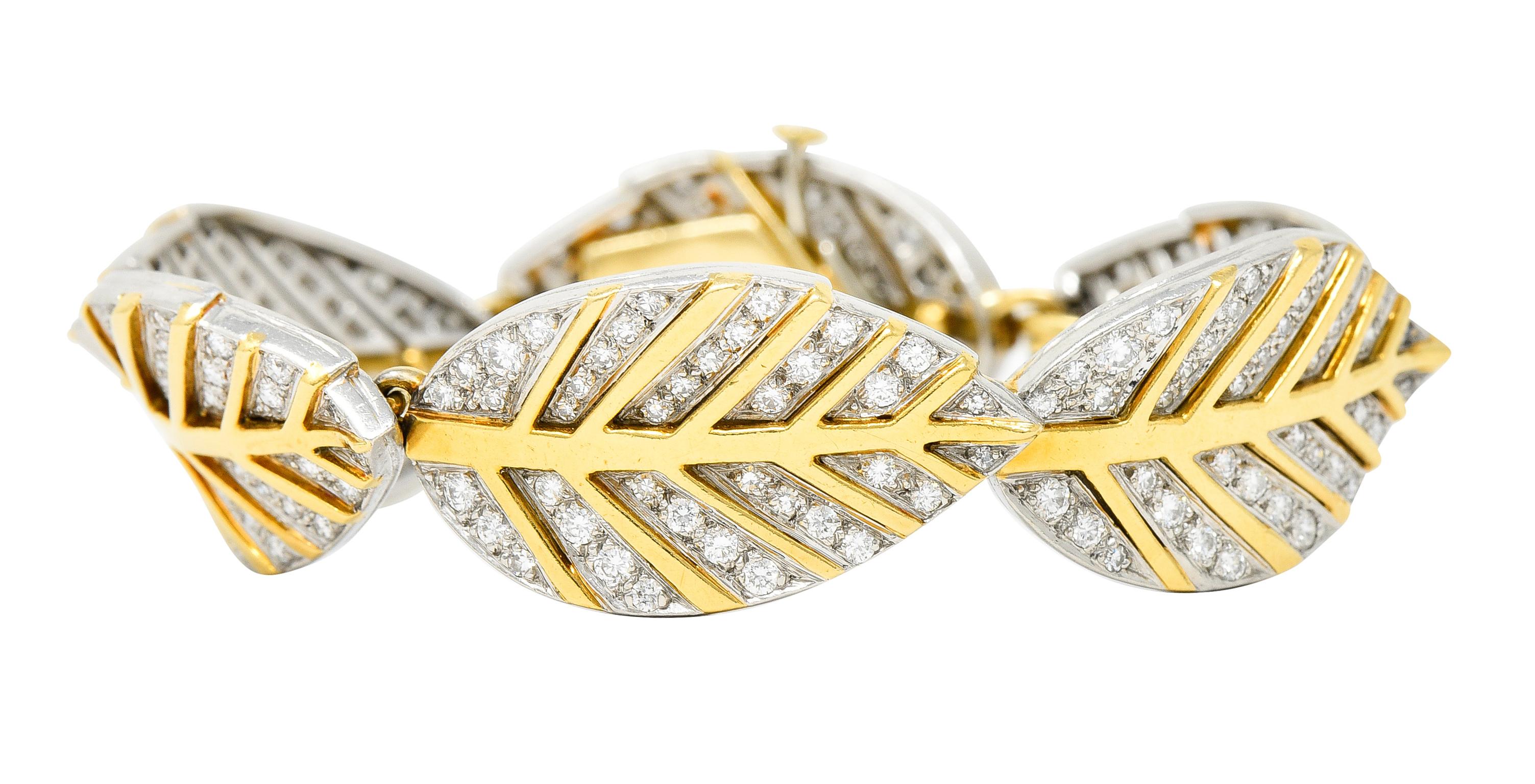 Link bracelet is comprised of navette shaped leaves

Links slightly articulate and facilitate an arched form

Leaves are platinum with polished gold veining

Then pavè set throughout by round brilliant cut diamonds

Weighing in total approximately