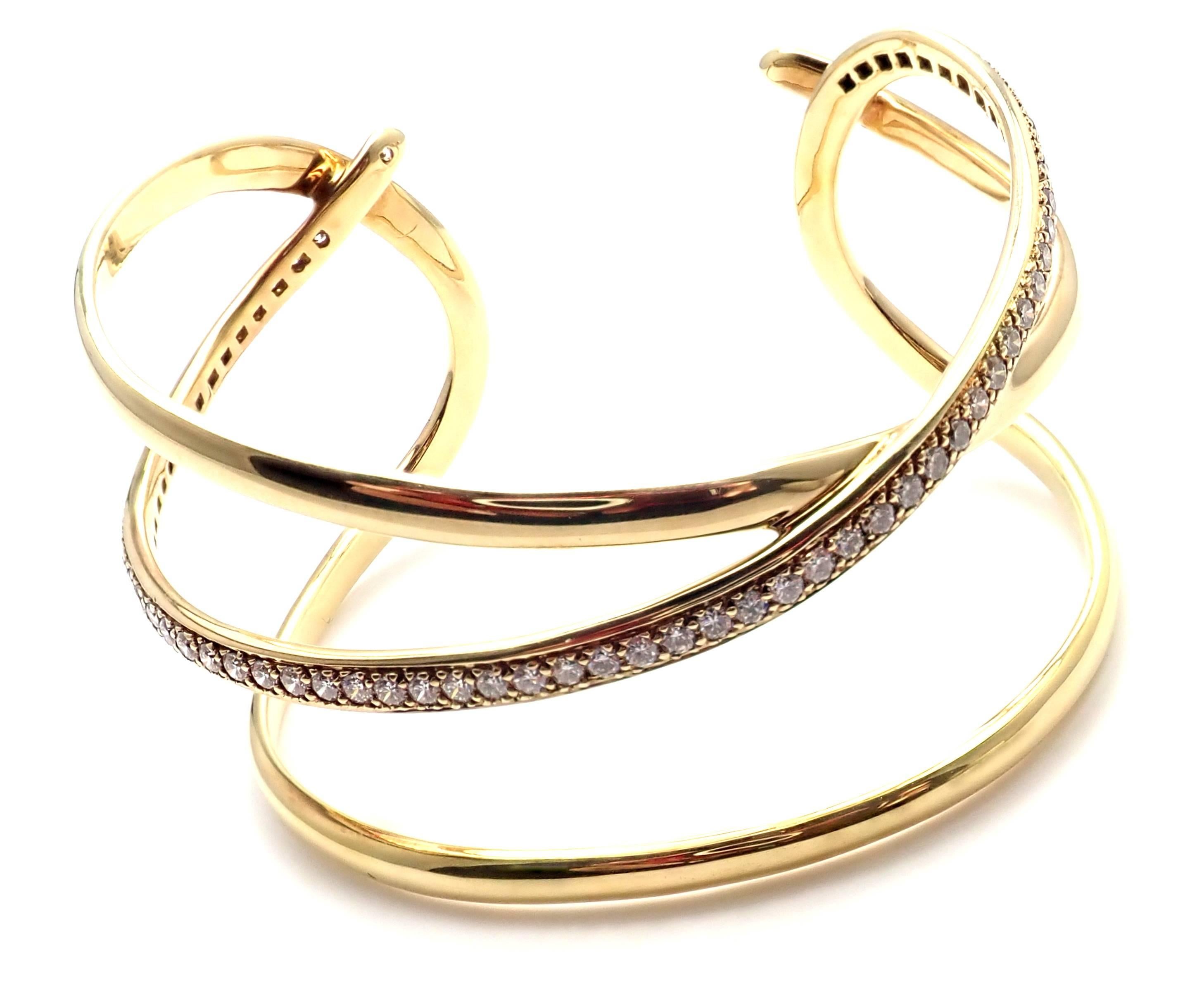 18k Yellow Gold Diamond Bangle Bracelet from Angela Cummings for Tiffany & Co.
Vintage from 1980's.
With 66 round brilliant cut diamonds VS1 clarity, G color Total weight approximately 2ct
Details: 
Weight: 39.6 grams
Length: 6 1/2