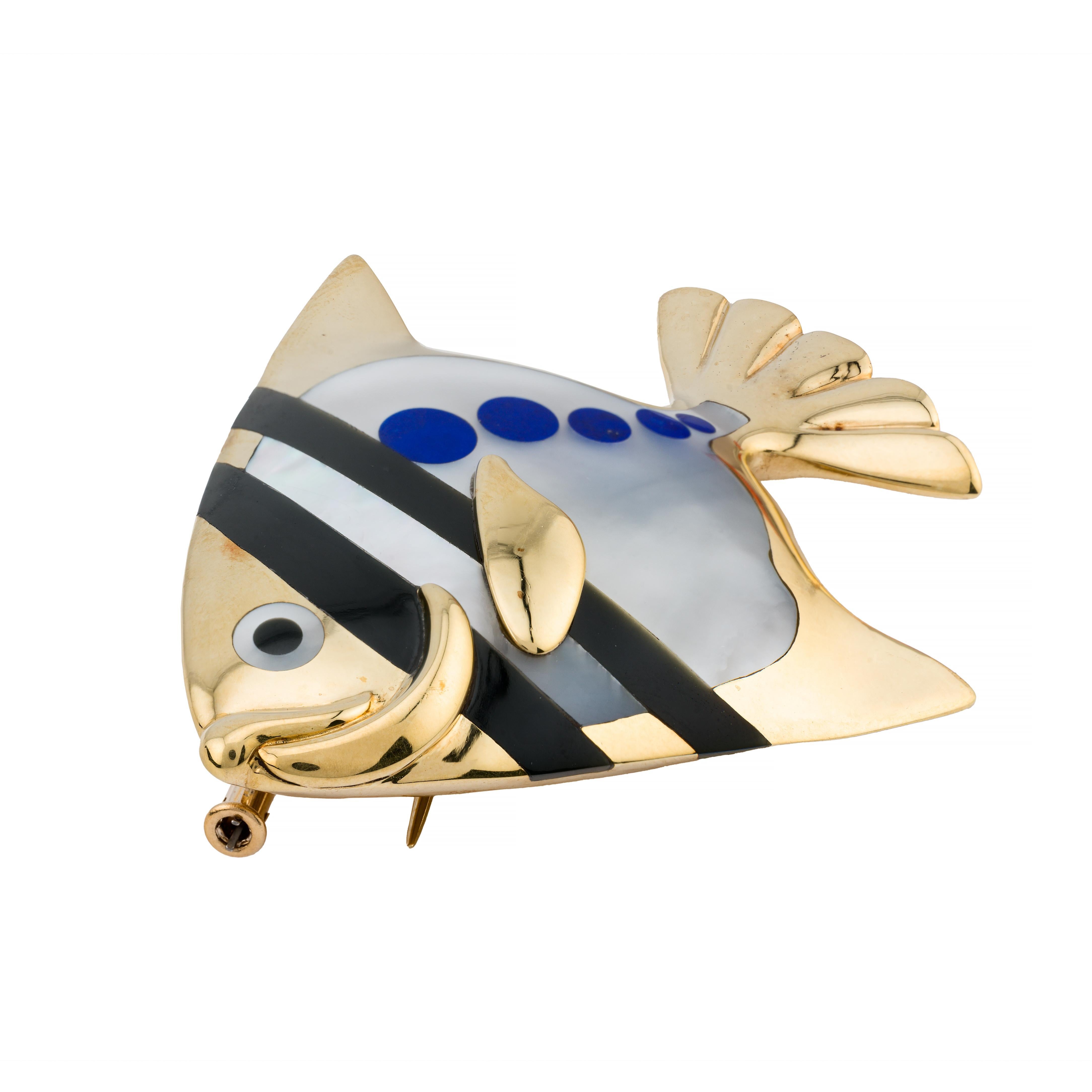 Aston Estate Jewelry Presents:

A Tiffany & Company brooch designed by Angela Cummings circa the 1970's.  In the form of a fish, crafted with exquisite detail. The body features a striking combination of lapis lazuli and onyx, accented with mother