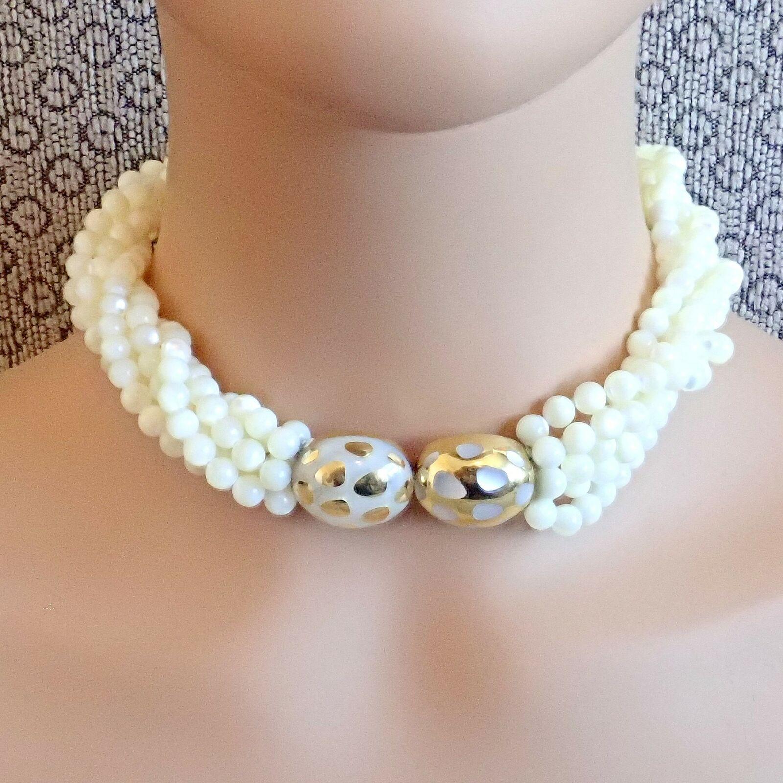 18k Yellow Gold Mother Of Pearl Bead Torsade Inlaid Necklace by Angela Cummings for 
Tiffany & Co. 
With 408 Mother Of Pearl Beads each approximately 6mm in size
1 main motif with inlaid mother of pearl 18mm x 44mm with clasp in center
Details: