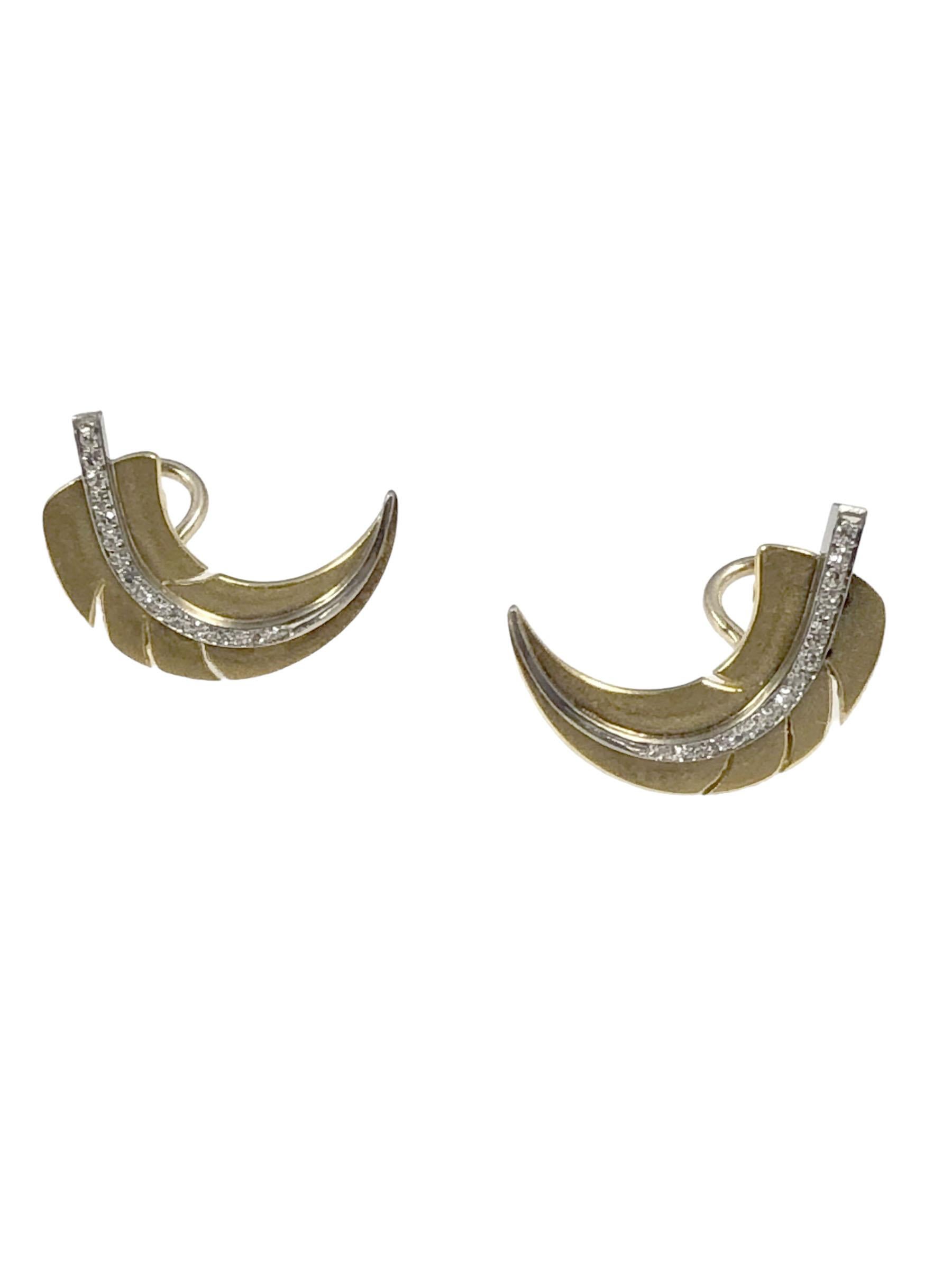 Circa 1980 Angela Cummings for Tiffany & Company 18k Yellow Gold, Platinum and Diamond Leaf Form Earrings, measuring 1 inch in length, 5/16 inch wide and weighing 8.1 Grams. set with round Brilliant cut Diamonds totaling .30 Carat. Having Omega clip