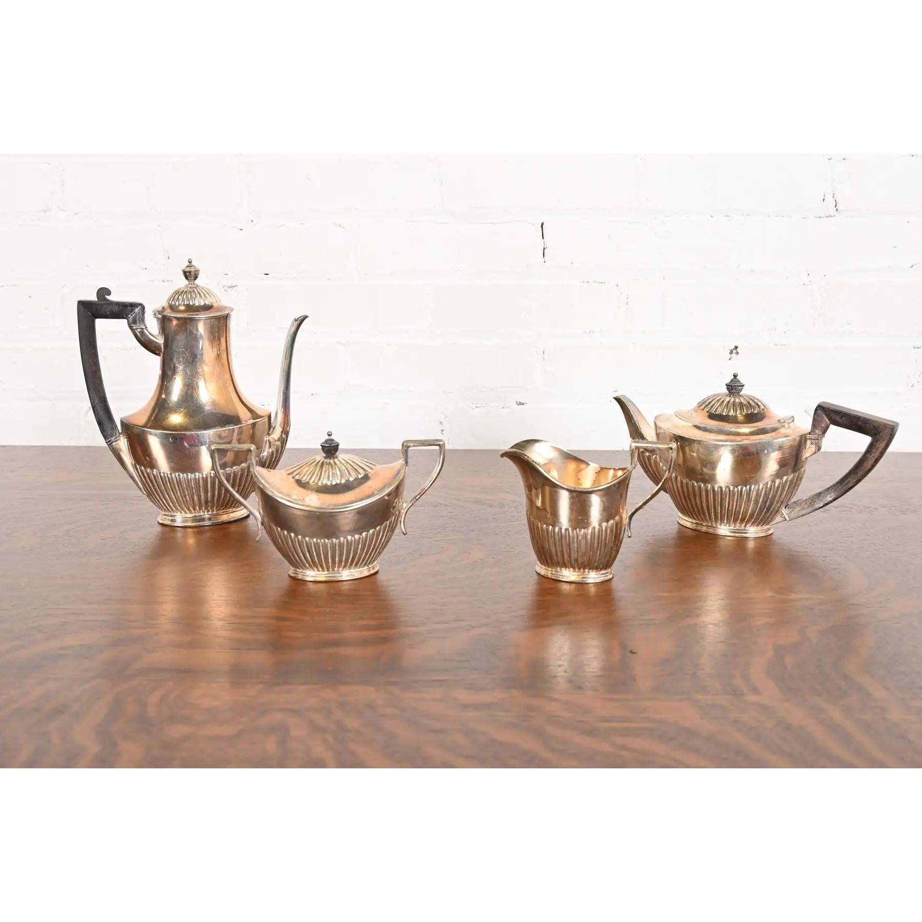 A gorgeous antique Art Deco silver soldered tea or coffee service set, including: coffee pot, tea pot, sugar bowl, and creamer.

By Tiffany & Co.

USA, Circa Late 19th Century

Measurements:
3