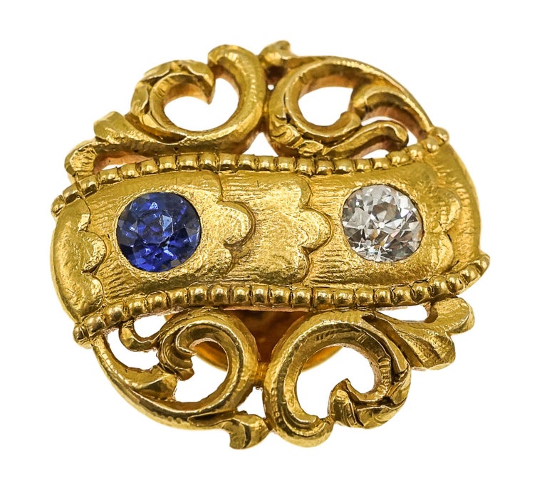 Each of scroll and openwork design set with a round diamond and round sapphire

Metal: 18k yellow gold
Diamonds: 2 old-cut diamonds with approximate total weight of 0.40 carat
Sapphires: 2 round sapphires with approximate total weight of 0.50 carat