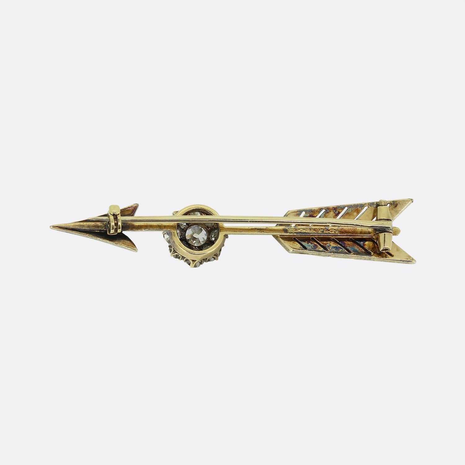 This is a truly stunning and rare antique arrow brooch from the luxury jewellery designer Tiffany & Co. The arrow features a central cluster of chunky old cut diamonds and a pave diamond set top and bottom. 
The brooch is crafted in 18ct yellow gold