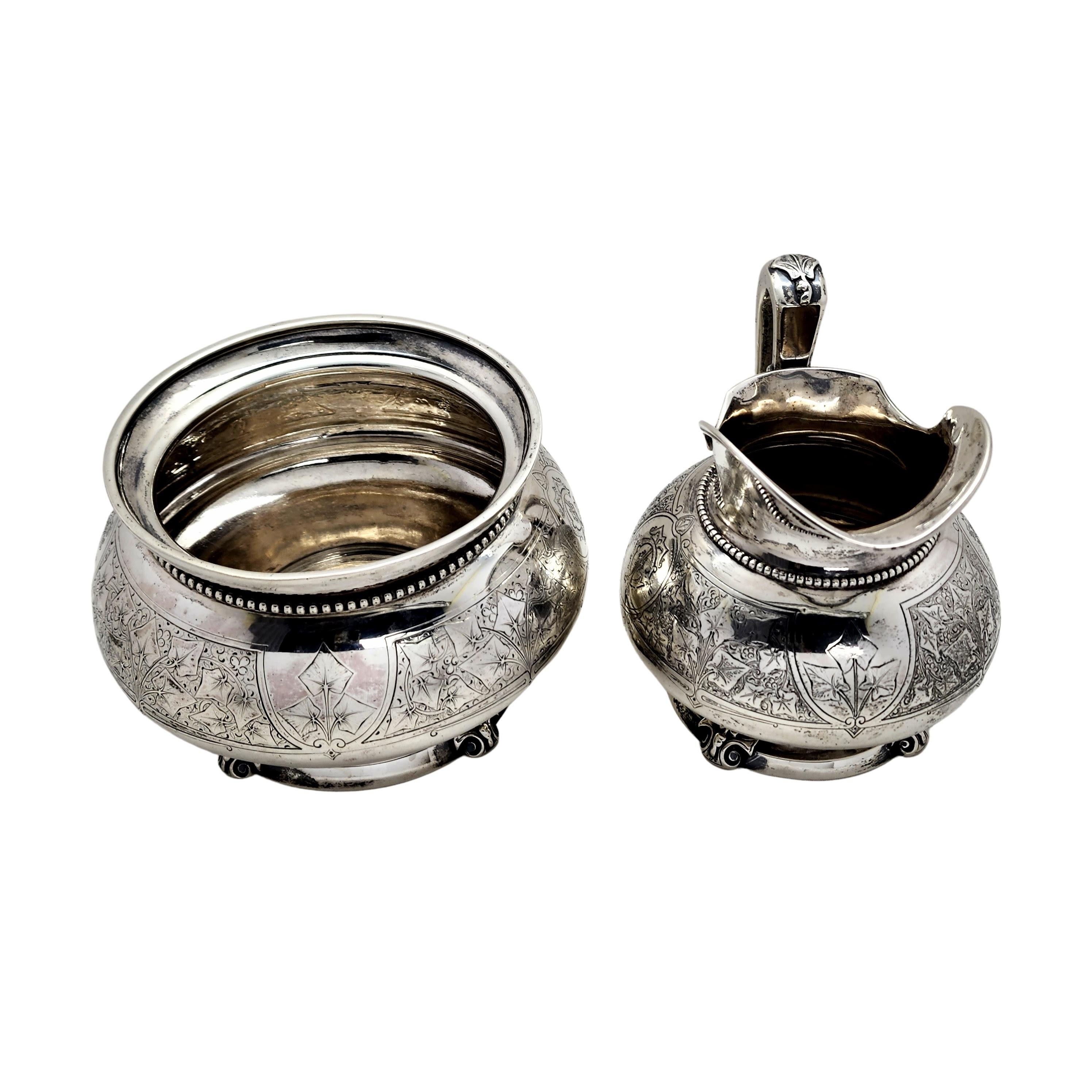 Antique sterling silver waste bowl and creamer in the Antique Ivy pattern by Tiffany & Co with monogram.

Monogram appears to be the intertwined letters TCM

Beautifully ornate ivy leaves surround both of these pieces and adorn the creamer's handle,