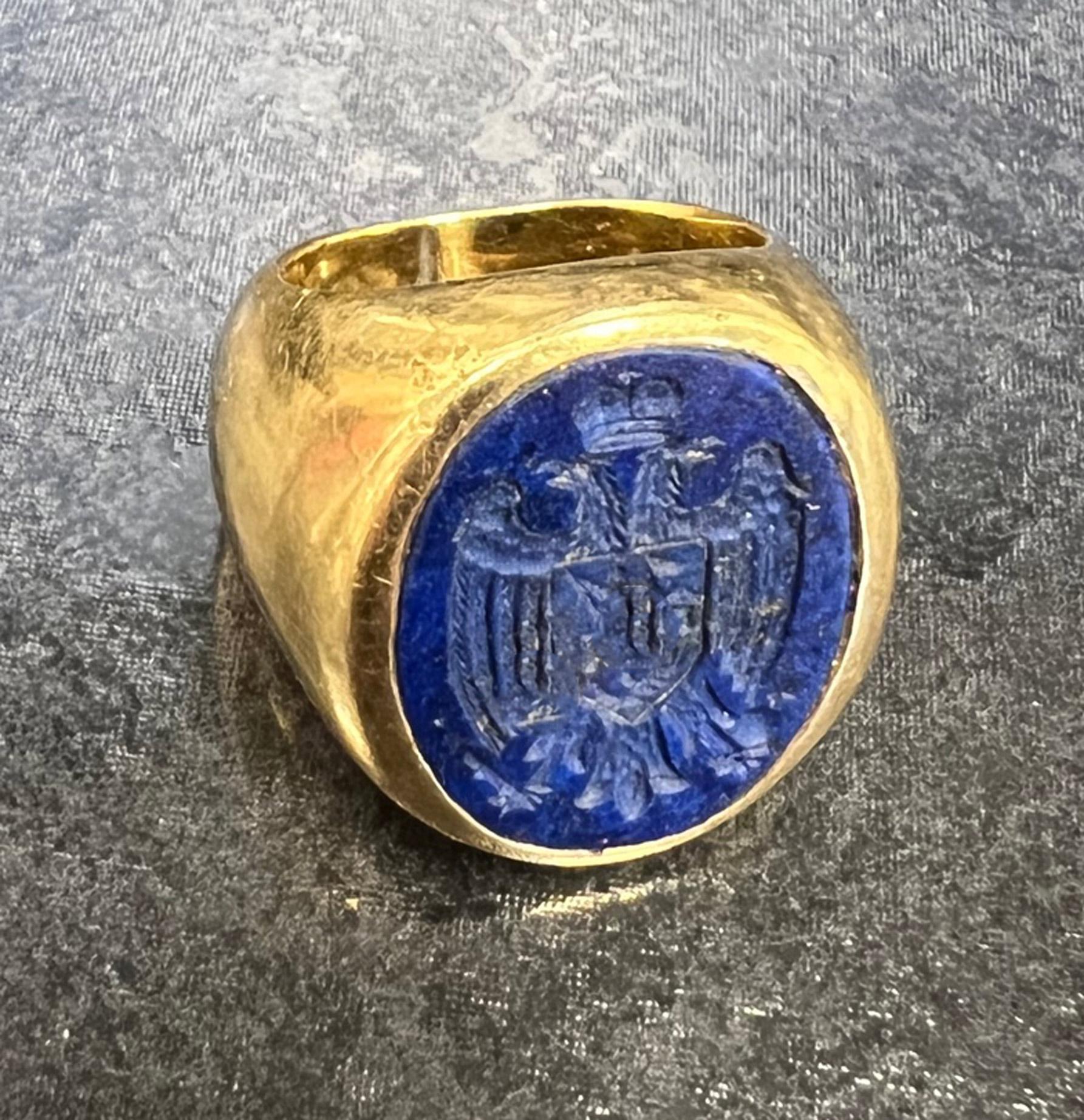 Unique turn of the century 18 karat gold lapis lazuli seal ring. The finely hand-engraved seal depicting the  Imperial Russian seal,  depicts 2 eagles with a crown over them, an emblem of knight on a horse in the center and a cross and scepter in