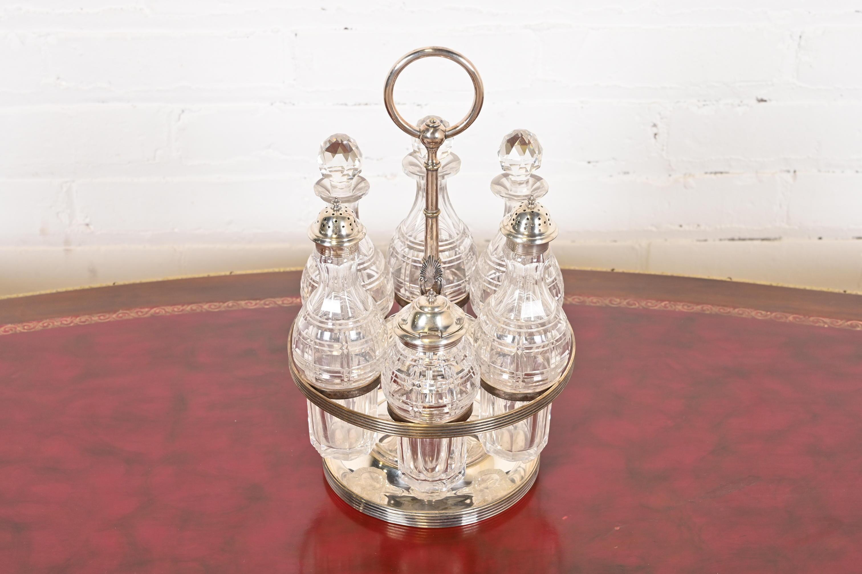 A gorgeous seven-piece silver plate and crystal cruet set

By Tiffany & Co. (signed at the base)

USA, Early 20th Century

Measures: 7.25