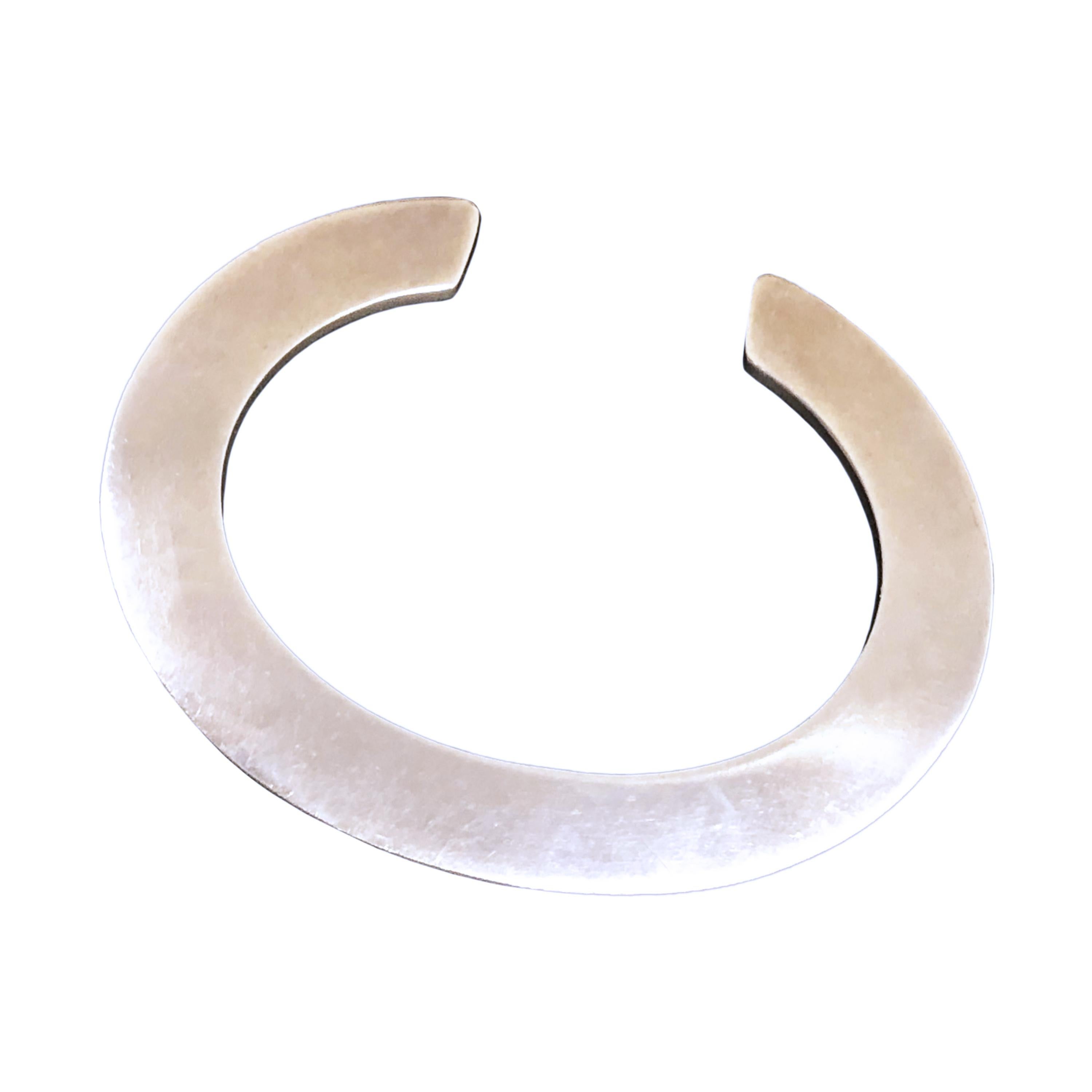 Circa 1960 Sterling Silver Mid Century Modern Design flat Cuff Bracelet for Tiffany & Company by Anton Michelsen,  Designer, Silversmith whom studied under Georg Jensen. This unique bracelet  measures 3 M.M. thick, 3/8 inch thick, has a 1 inch wide