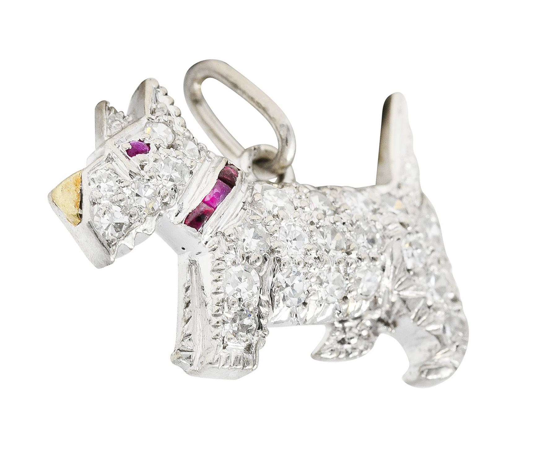 Charm is designed as a Scottish Terrier dog. Pavè set throughout by single cut diamonds weighing approximately .30 carat - G to I color with VS to SI clarity. With a calibrè cut ruby collar and inset eye weighing in total approximately 0.05 carat.