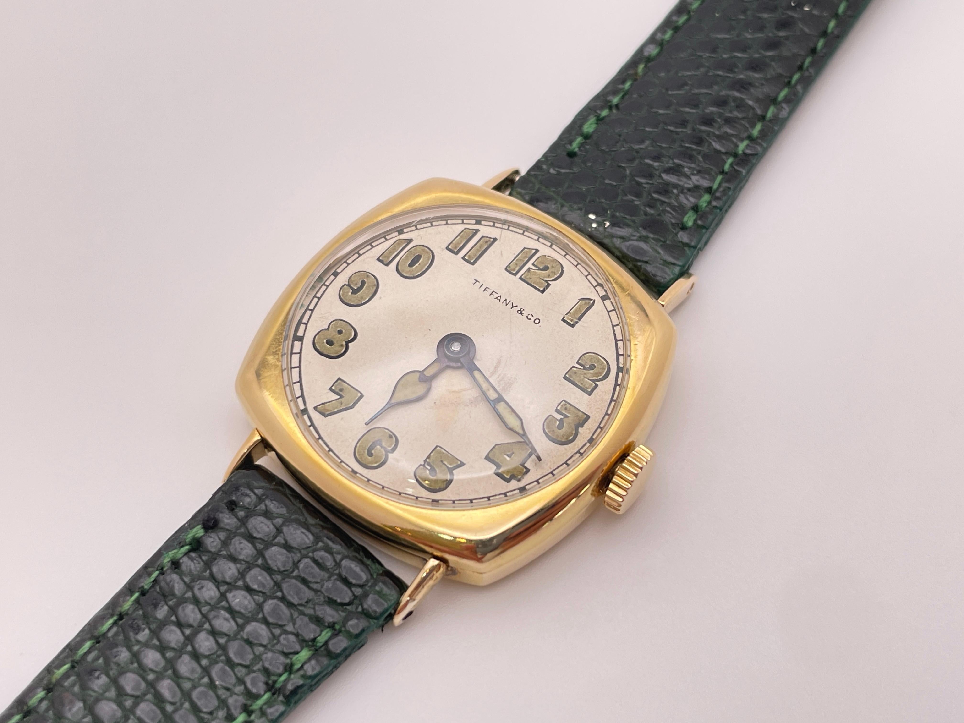 An iconic Art Deco IWC (International Watch Company) and Tiffany & Co. 18K yellow gold manual wind (mechanical) wrist watch, circa 1920s. 

This magnificent timepiece features an 18K yellow gold case, white dial, silvered Art Deco luminous (glow in
