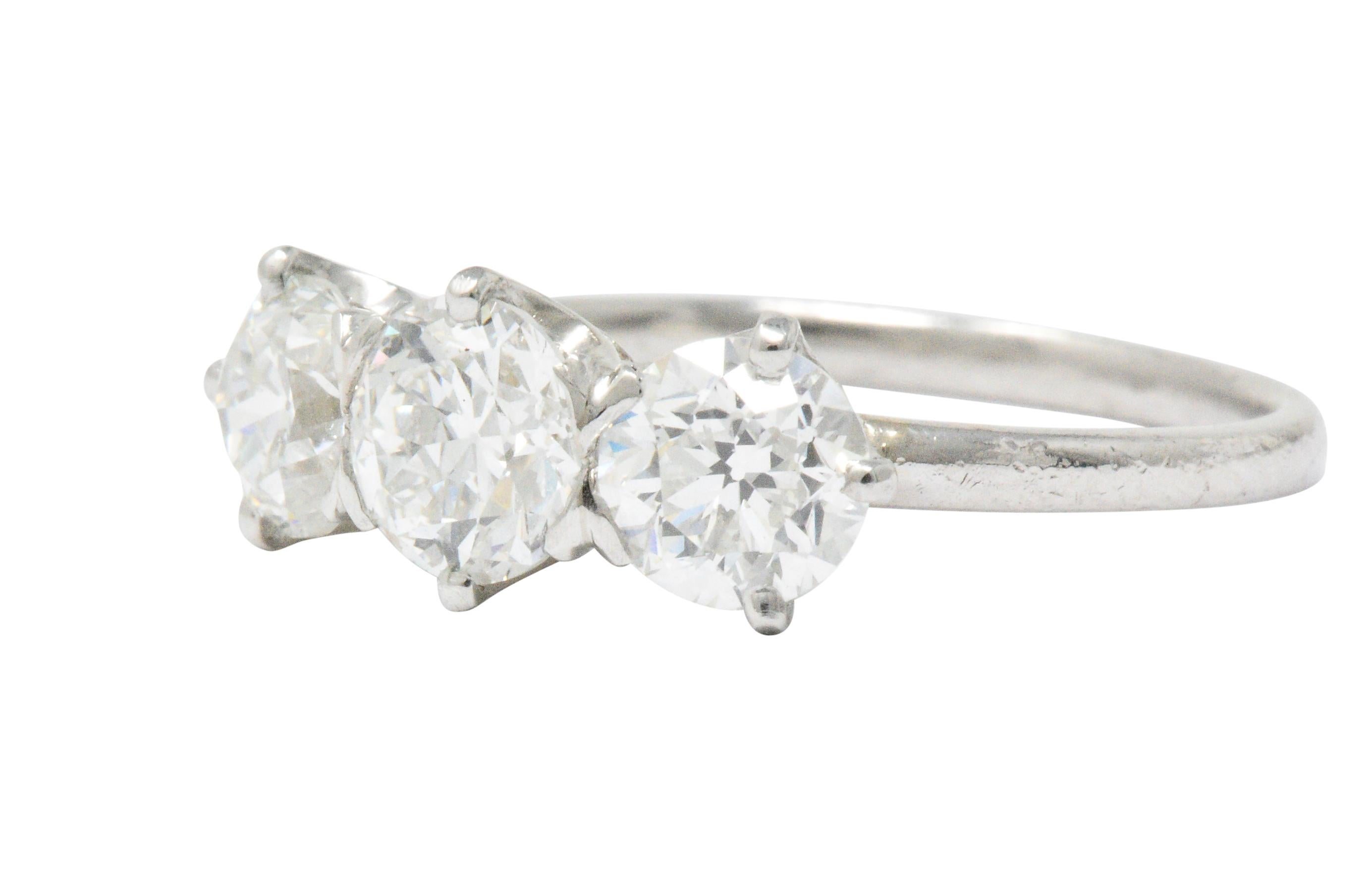 Designed as three old European cut diamonds, prong set East to West

Center weighs 0.81 carat with H color and VS2 clarity

Flanked stones weigh 0.71 carat with H color and VS2 clarity then 0.67 carat with I color and 
VS1 clarity

2.19 CTW

Tested
