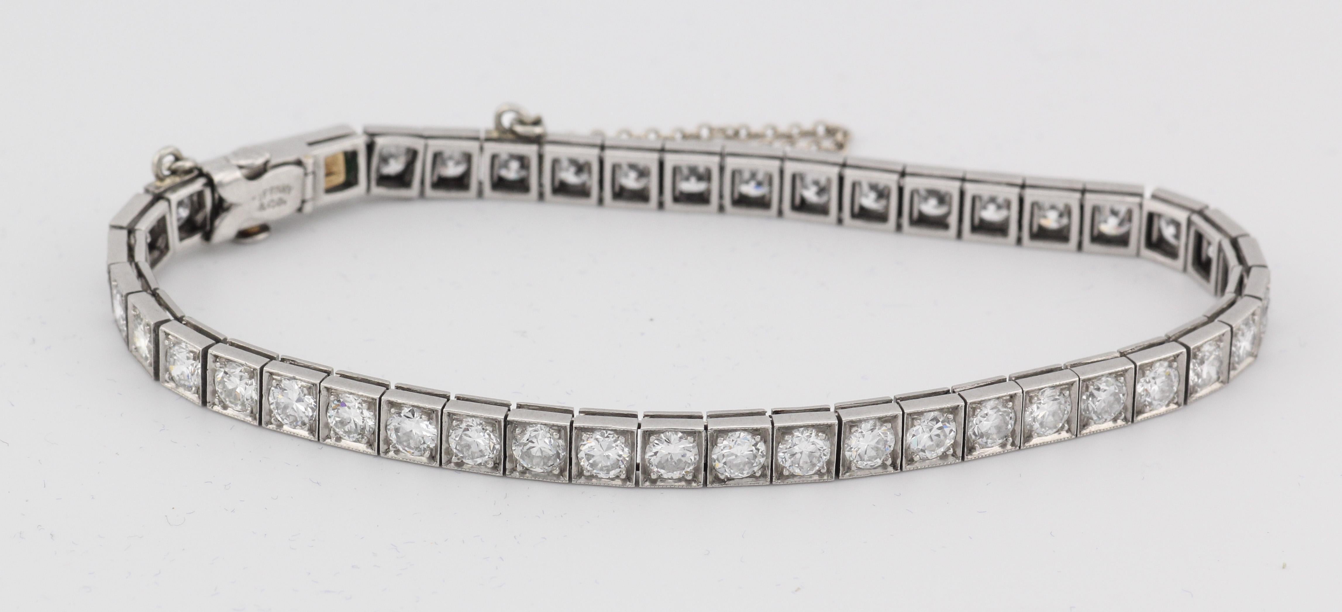 Step into the world of timeless sophistication and luxurious elegance with the Tiffany & Co. Art Deco 5 CTW Diamond Emerald Platinum Line Tennis Bracelet. Crafted with meticulous attention to detail, this exquisite piece is a testament to the luxury