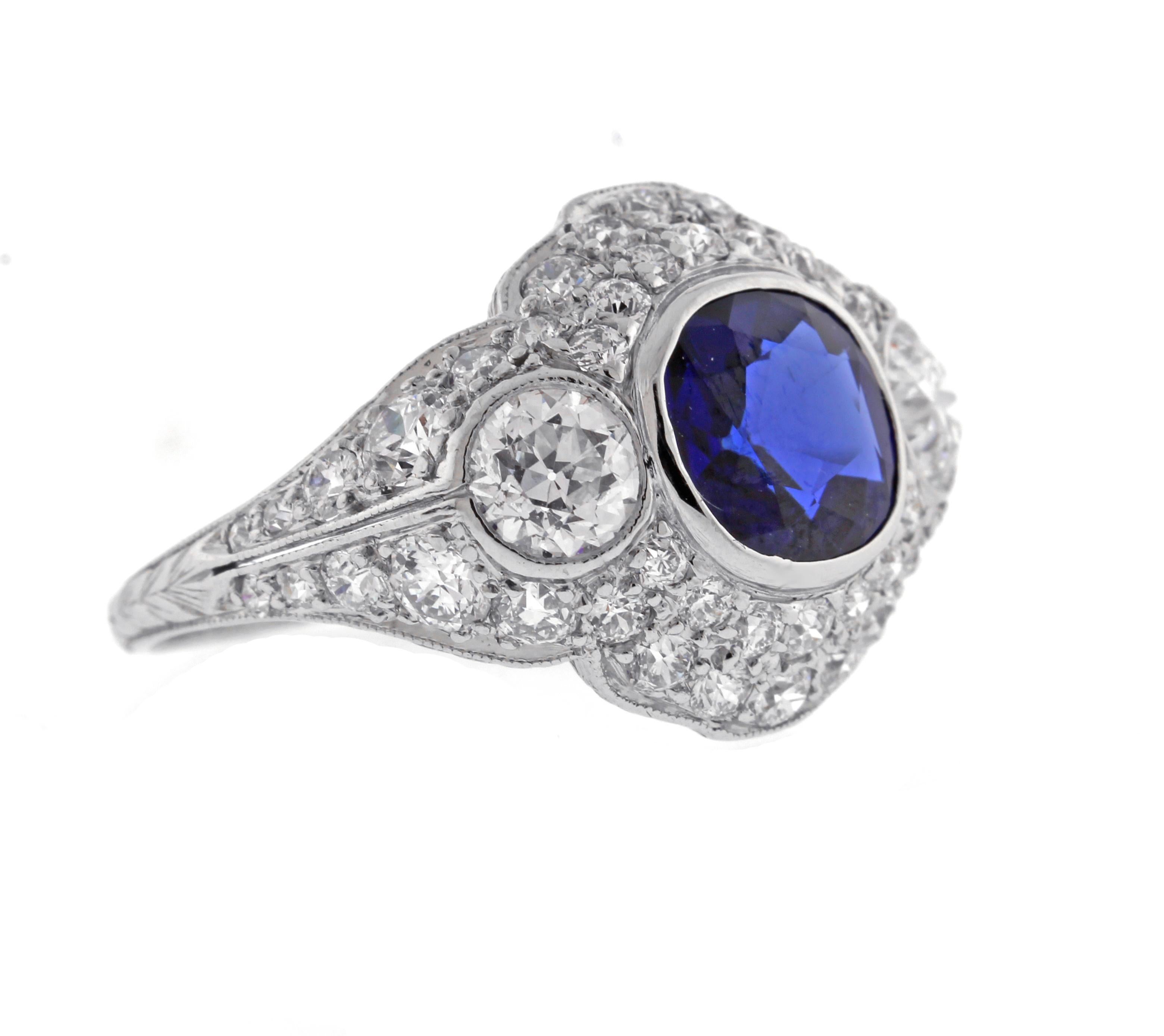 A classics example of Art Deco design. This platinum Tiffany & Co ring is over 100 years old. The ring features a cushion cut sapphire weighing 1.95 carats. The ring is signed Tiffany and engraved  JCK to JH 1921
♦ Designer: Tiffany & Co
♦ Metal: