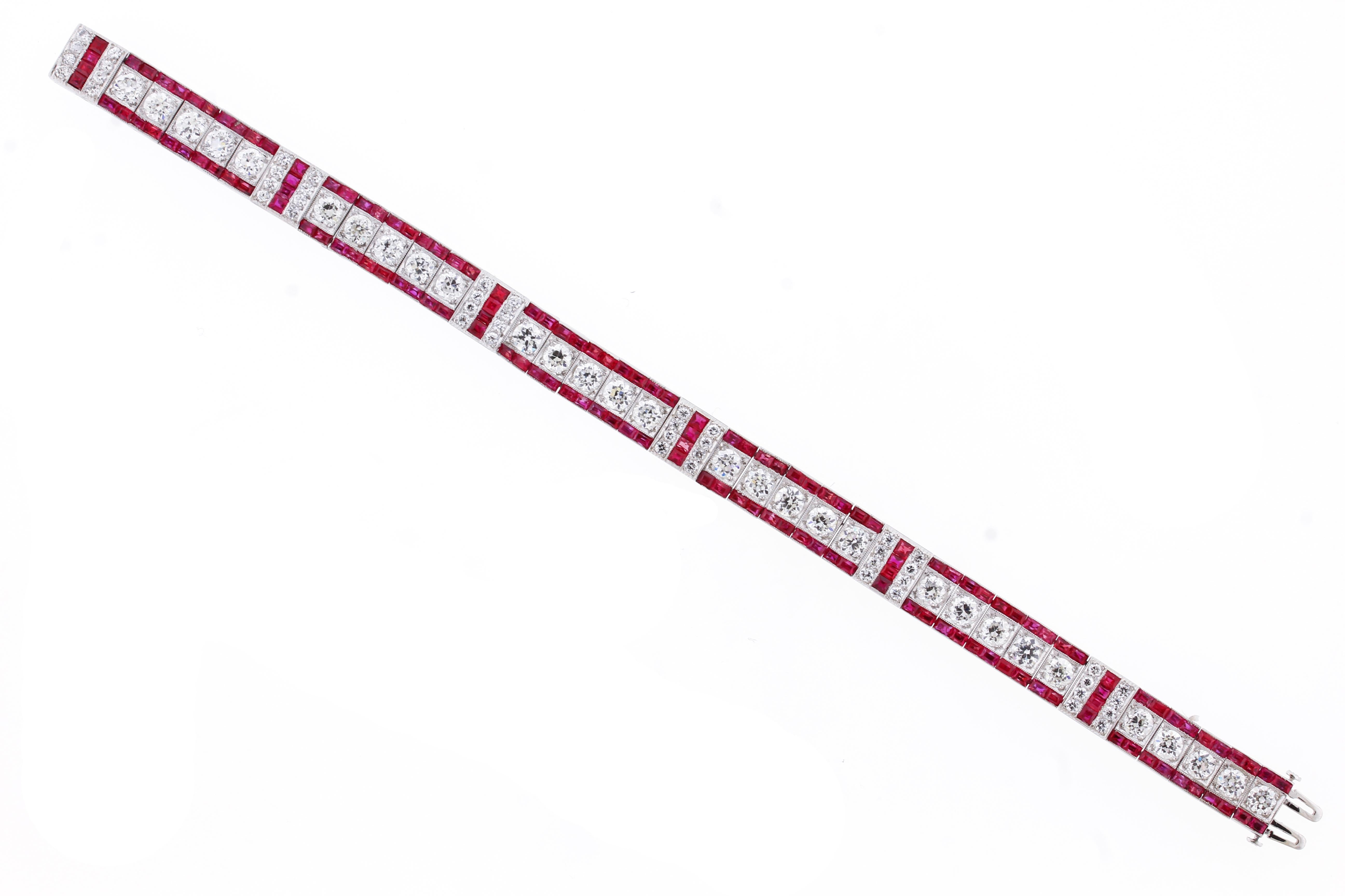 From Tiffany & Co. an exception Art Deco natural ruby and diamond bracelet.
♦ Designer: Tiffany & Co.
♦ Platinum
♦ Circa 1920s
♦ 128 Square Natural Burma  A.G.L Certified Rubies = 7.40 carats
♦ 30 Old European Diamond=7.50 carats, 48 round  Diamond