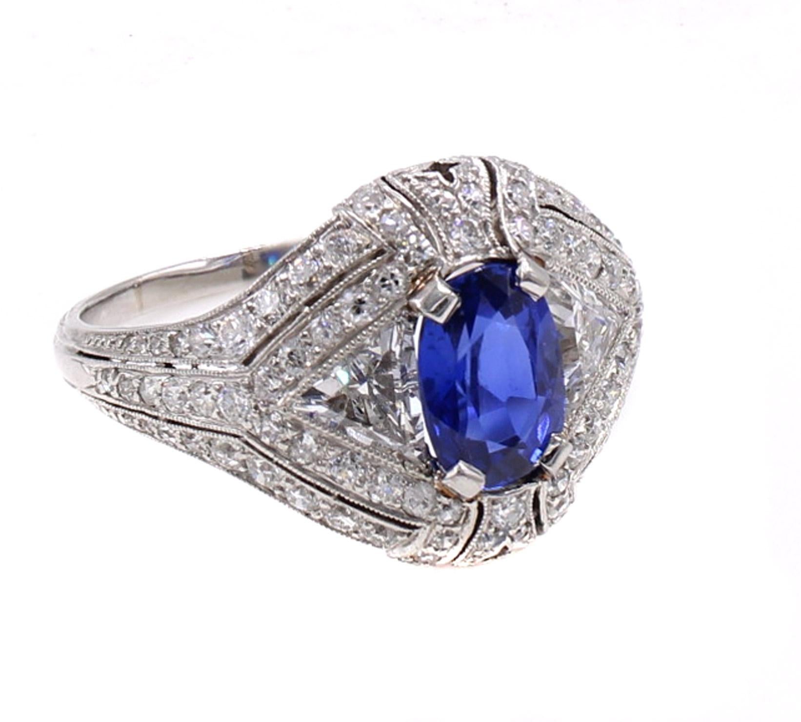 This unique Tiffany & Co. Art Deco ring from ca 1925 is beautifully designed and amazingly hand crafted, to the high standards of early Tiffany jewelry. Featuring an oval sapphire approximately 2 carats in weight, with a gorgeous deeply saturated