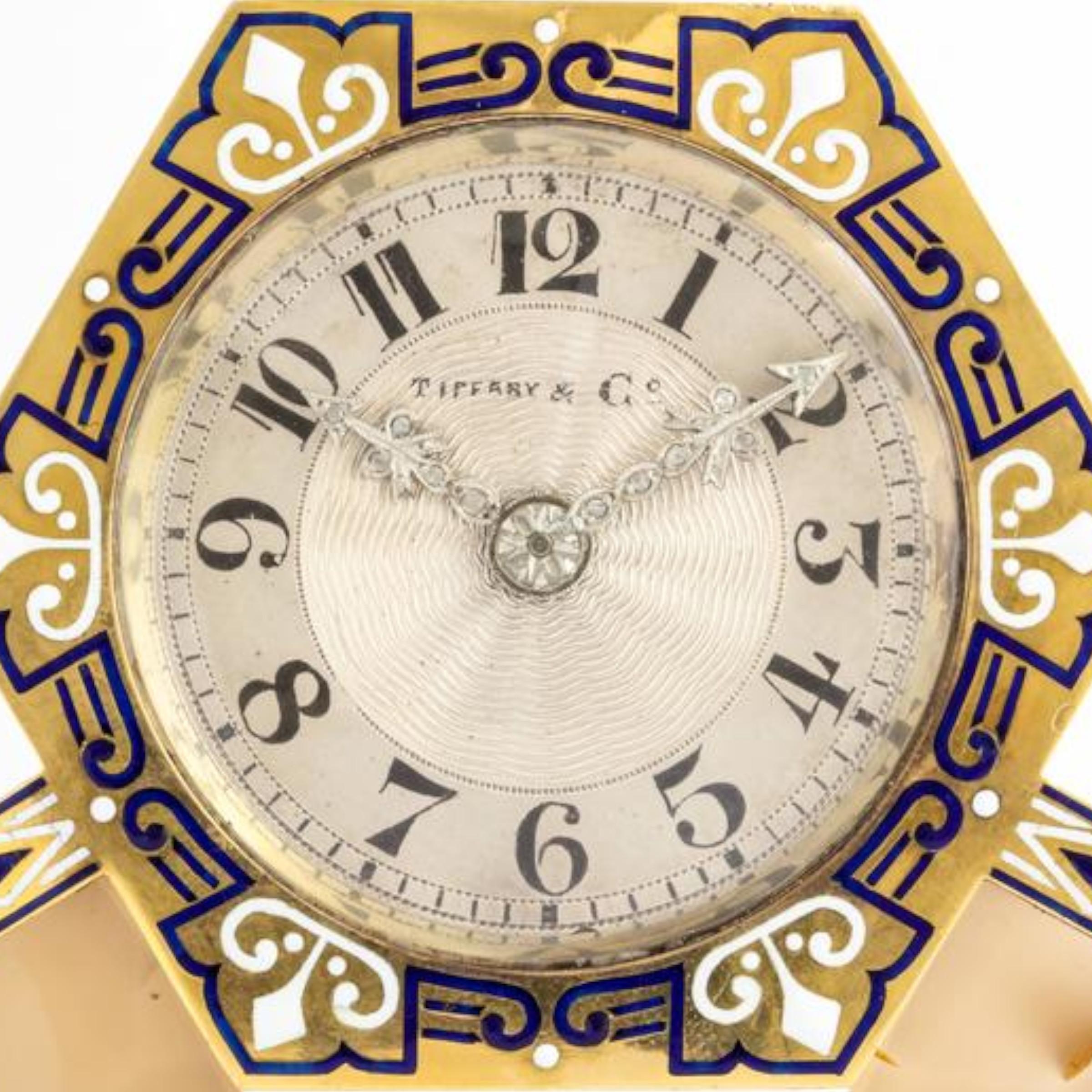 Art Deco Tiffany and Co Clock 

Comprised of: gold, silver, carved hardstone, old cut diamonds, and blue and white enamel.

Made circa 1925

Dial signed Tiffany & Co. French maker's Mark stamps

Depicted in full page spread in the 