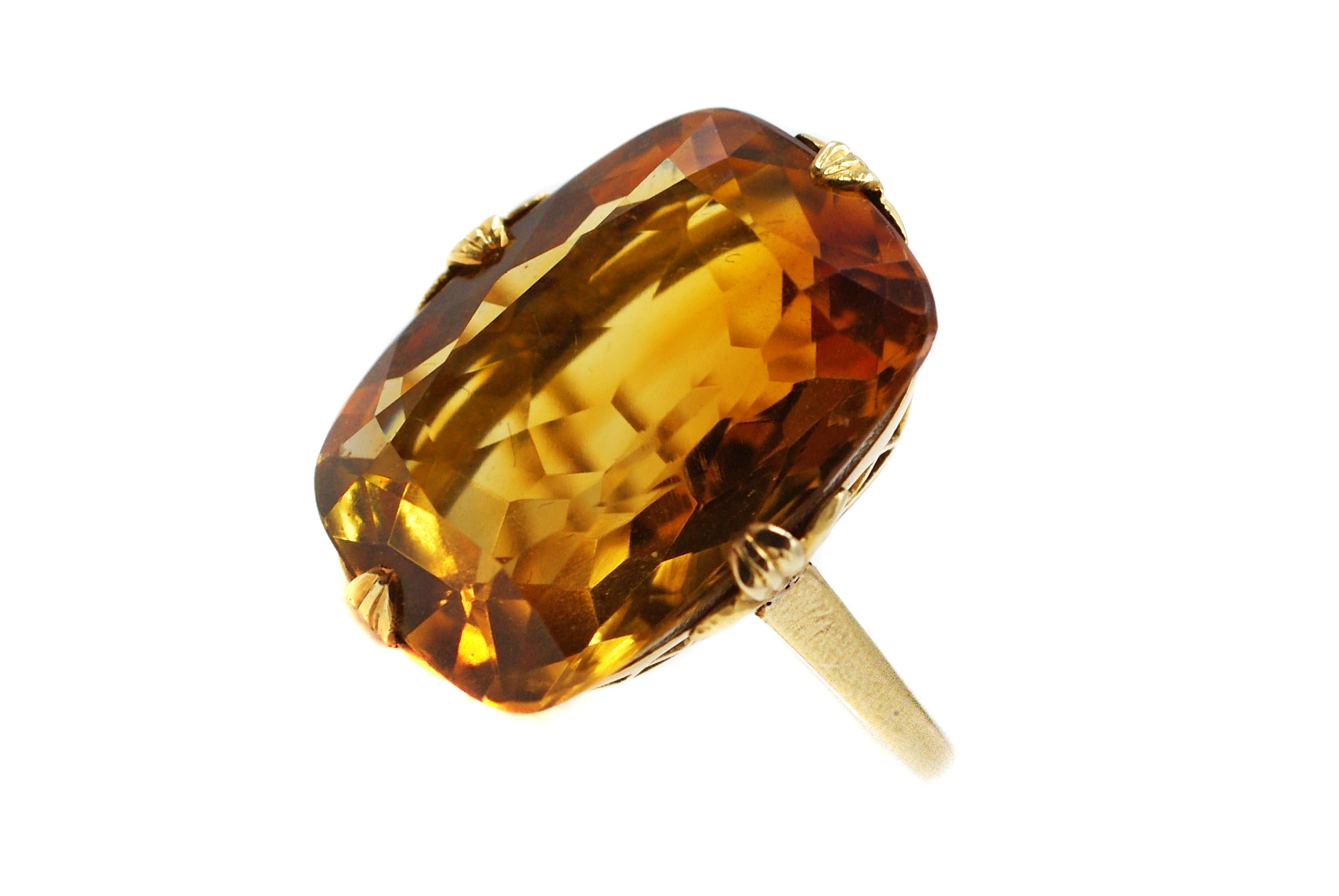 This gorgeous Tiffany & Co. Art Deco ring from ca. 1925 cradles a golden faceted Citrine measured to weigh approximately 16 carats. The perfect elongated cushion shape and impeccable faceting gives this gemstone and amazing brilliance and fire. A