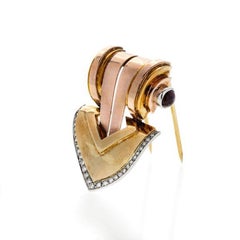 Tiffany & Co. Late Art Deco Clip Brooch in Gold, Diamonds and Rubies
