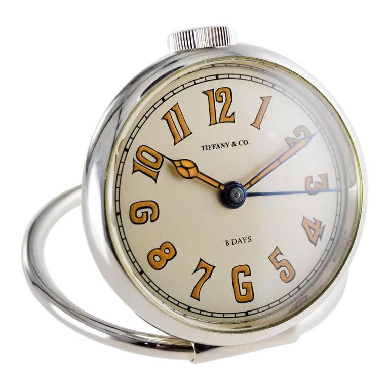 FACTORY / HOUSE: Tiffany & Co. by Concord
STYLE / REFERENCE: Alarm
METAL / MATERIAL: Nickle
CIRCA / YEAR: 1950's
DIMENSIONS / SIZE:  Length X Diameter
MOVEMENT / CALIBER: Manual Winding / 15 Jewels 
DIAL / HANDS: Silvered with Luminous Numerals /