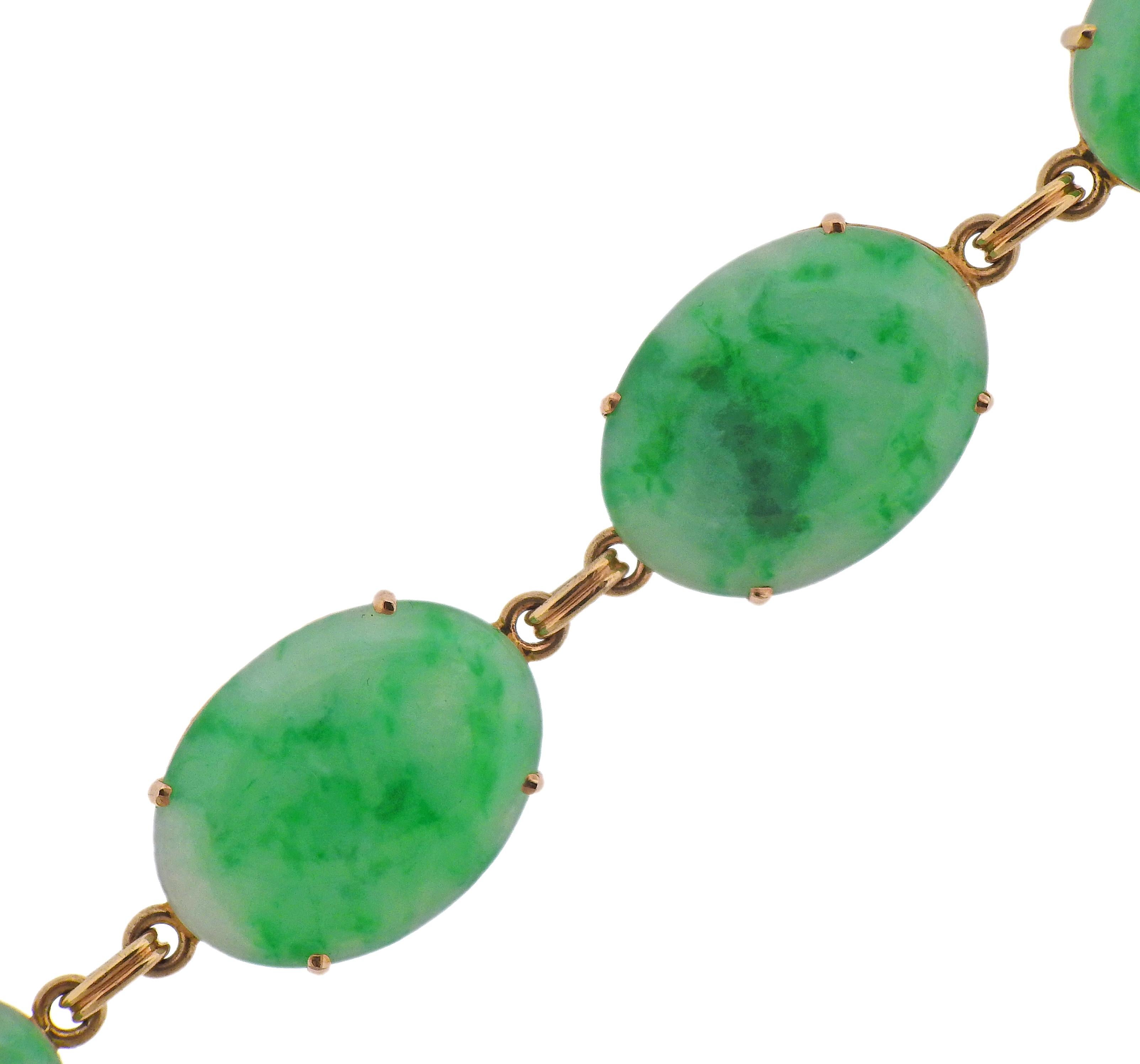 Art Deco 14k gold bracelet by Tiffany & Co, with 6 oval jade stones - measuring from 18 x 14mm to 23 x 17mm. Bracelet is 7 3/8
