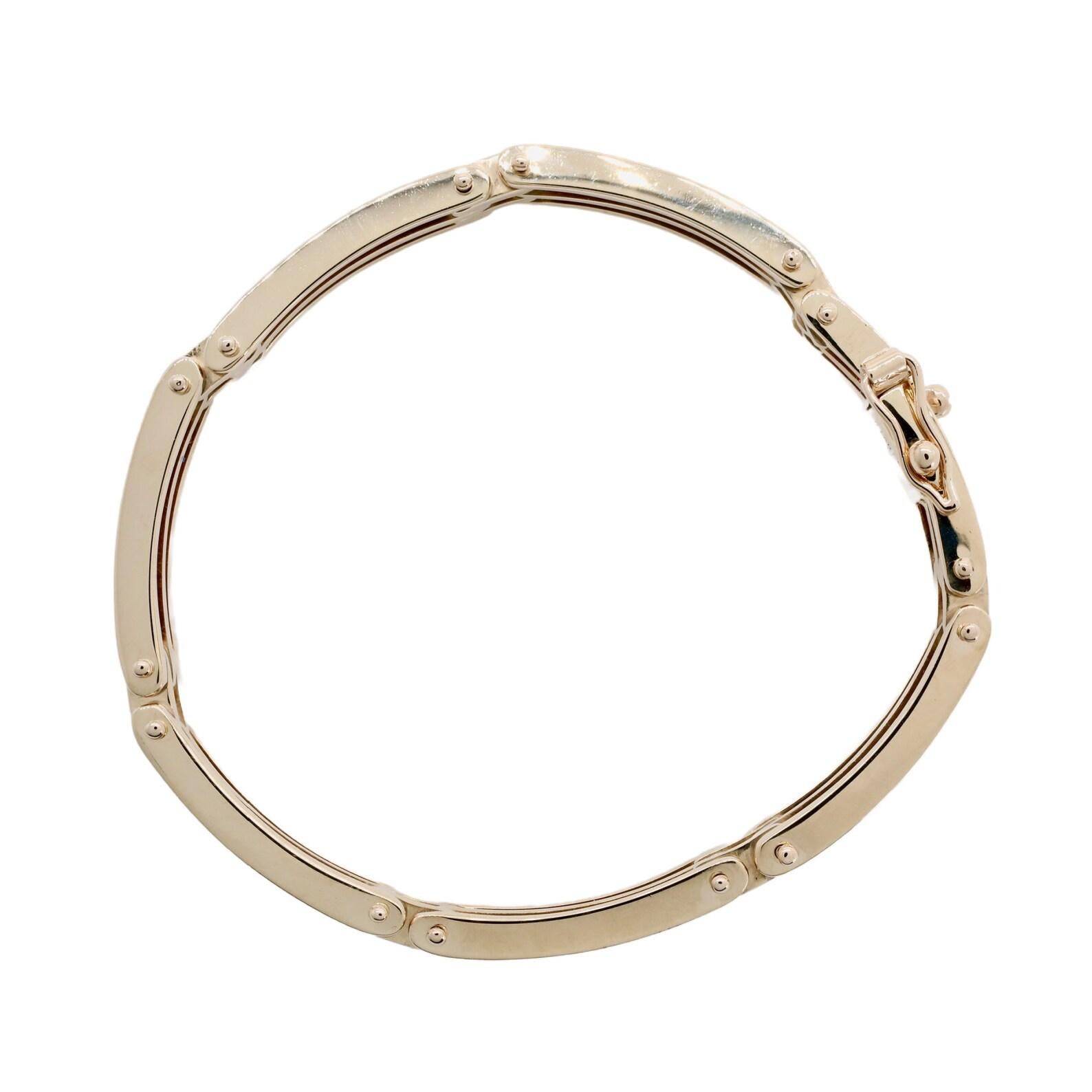 A machine age, late Art Deco Tiffany & Company mans, or unisex bracelet. Weighing a hefty 52 grams, this bracelet is handmade and solid. The bracelet consists of elongated curved links in groups of three, connected by pairs of shorter links.