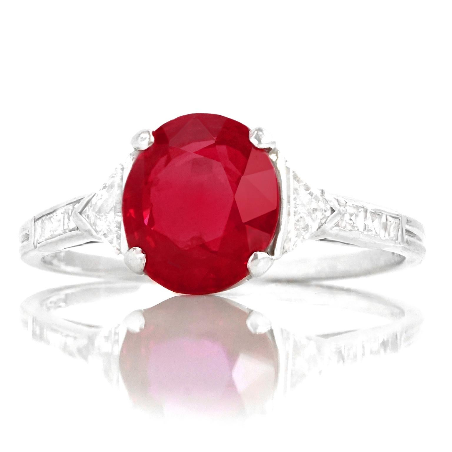 Circa 1920-30s, Platinum, by Tiffany & Co, New York.  This magnificent Art Deco ring by Tiffany & Co. is set with an incredible 2.63 carat no-heat Mogok region Burma Ruby (AGL Report). Set in platinum and flanked by .75 carats of brilliant white