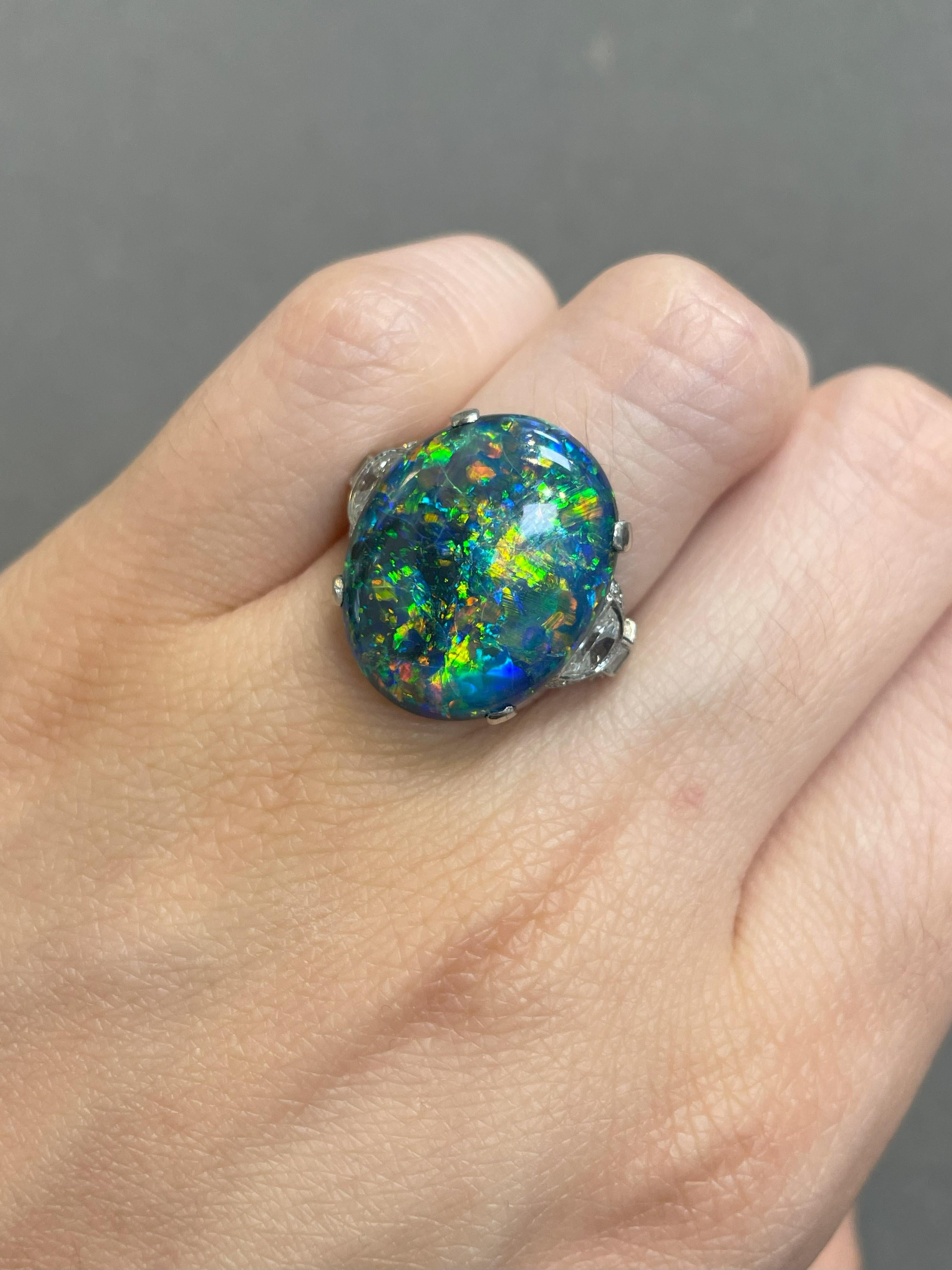 Tiffany & Co Art Deco Opal and Diamond Ring

A Tiffany and Co. ring set with an oval black opal accented by 2 half-moon shaped, 32 old European-cut and 6 baguette diamonds. 

Approximate Opal Weight: 10.65 carats
Approximate Diamond Weight: .50