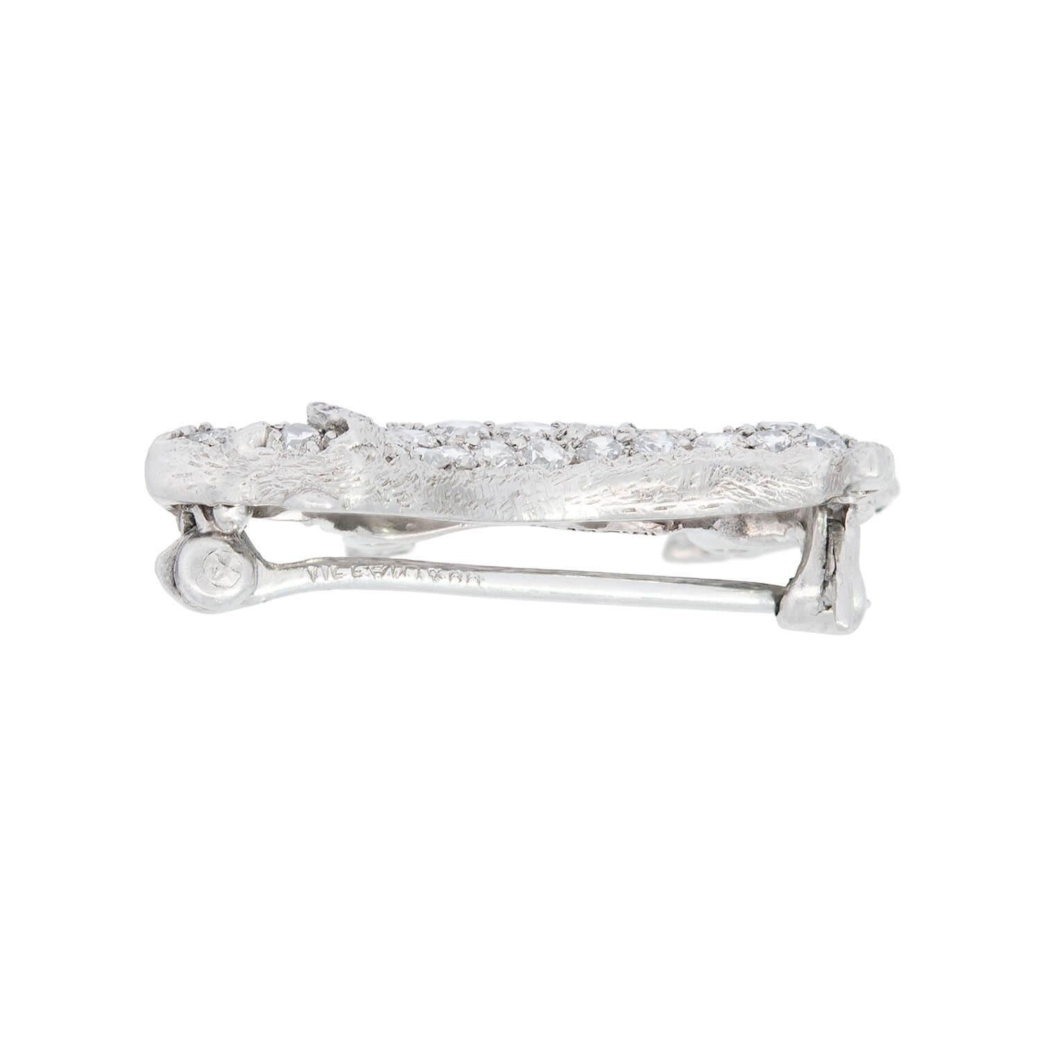 A very charming Tiffany & Co. dog pin from the Art Deco (ca1920) era! Crafted in platinum, this wonderful piece portrays the shape of a terrier. The surface of the pin is adorned with pave full cut diamonds. The terrier is standing regally, and
