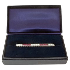 Tiffany & Co. Art Deco Ruby and Diamond BarBrooch, Platinum, Circa 1930. Signed.