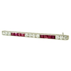 Tiffany & Co. Art Deco Ruby and Diamond BarBrooch, Platinum, Circa 1930. Signed.