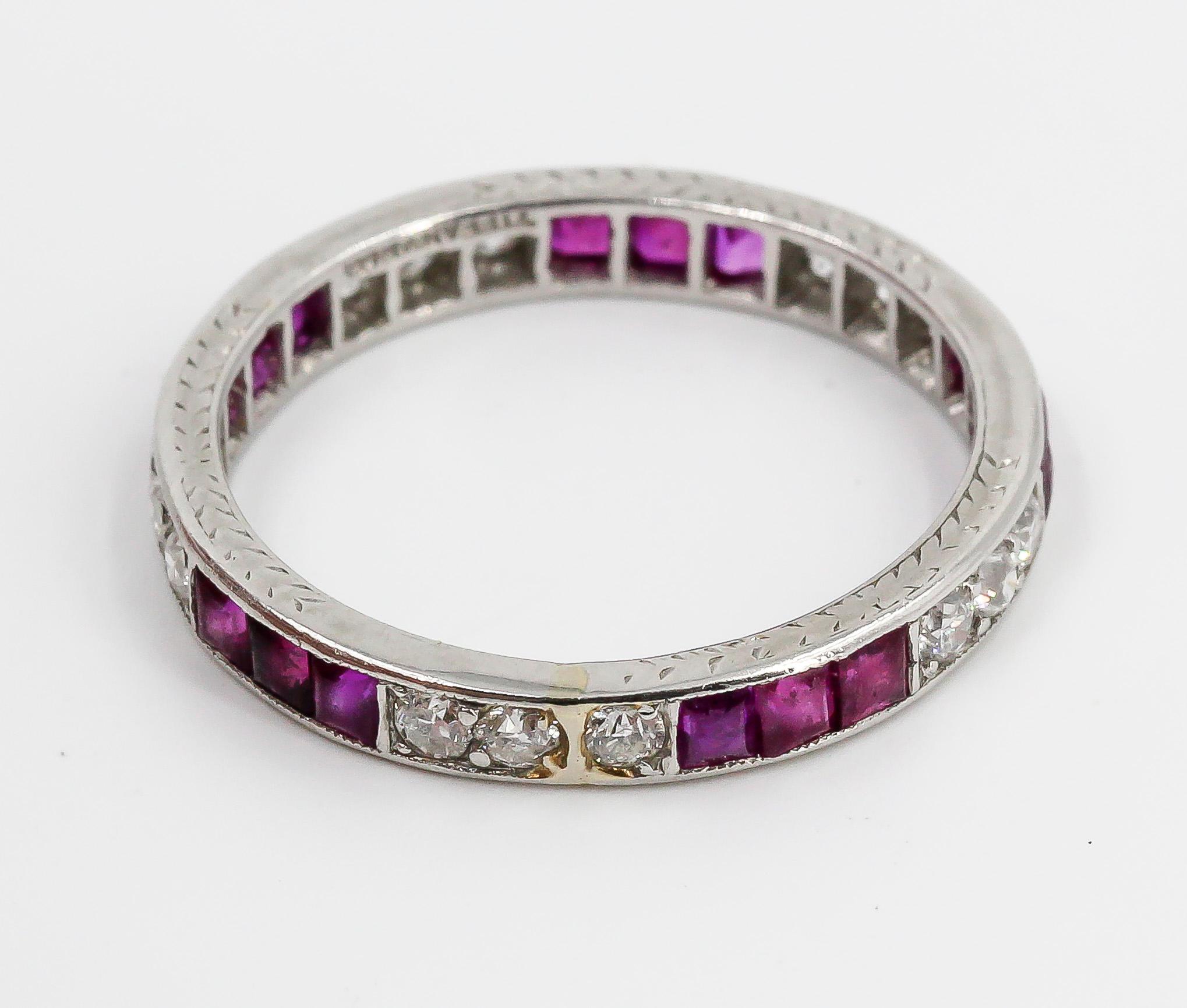 Elegant ruby and diamond band by Tiffany & Co., circa 1920s. It features rich red rubies and high grade round brilliant cut diamonds. Size 6.5. 

Hallmarks: Tiffany & Co., Irid. plat.