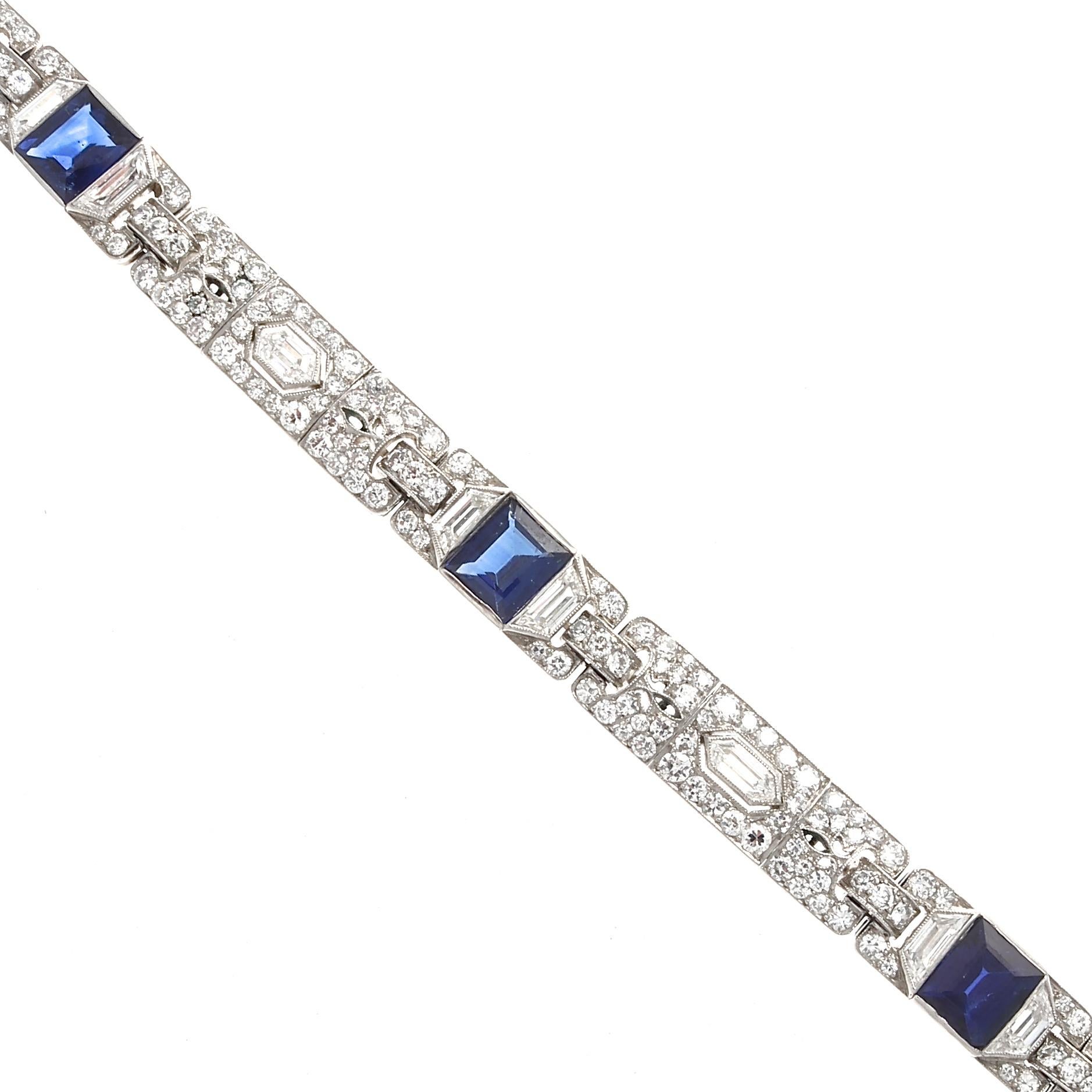 Quintessential design from the most admired jewelry house of the time. Featuring four 3.50 carat carre cut royal blue sapphires that are AGL certified as Pailin region with no indications of heat treatment. Separated by elaborate links of specialty