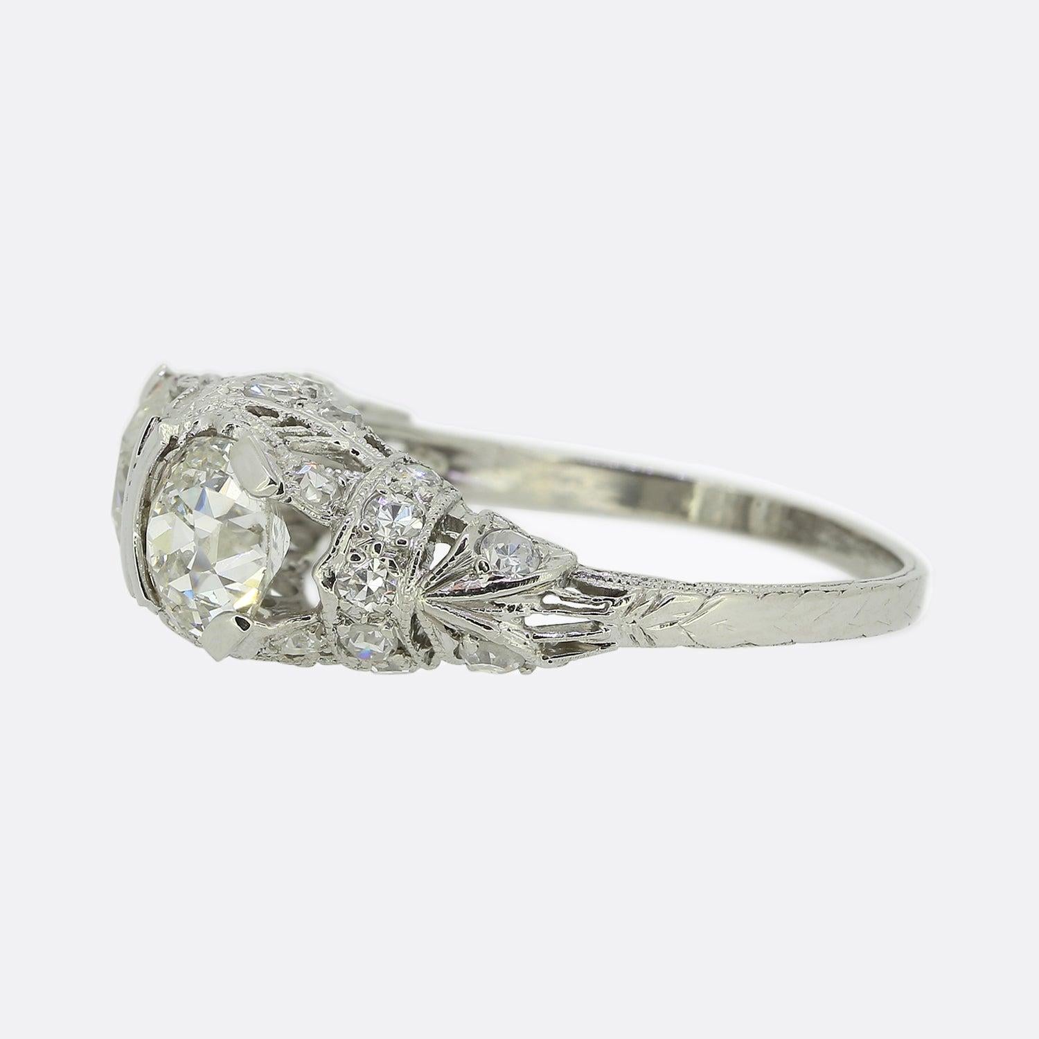 Here we have an original Art Deco diamond two-stone ring from the world renowned luxury jewellery designers, Tiffany & Co. This piece has been crafted from platinum and showcases two proud old cut diamonds at the centre of the face. Sleek geometric