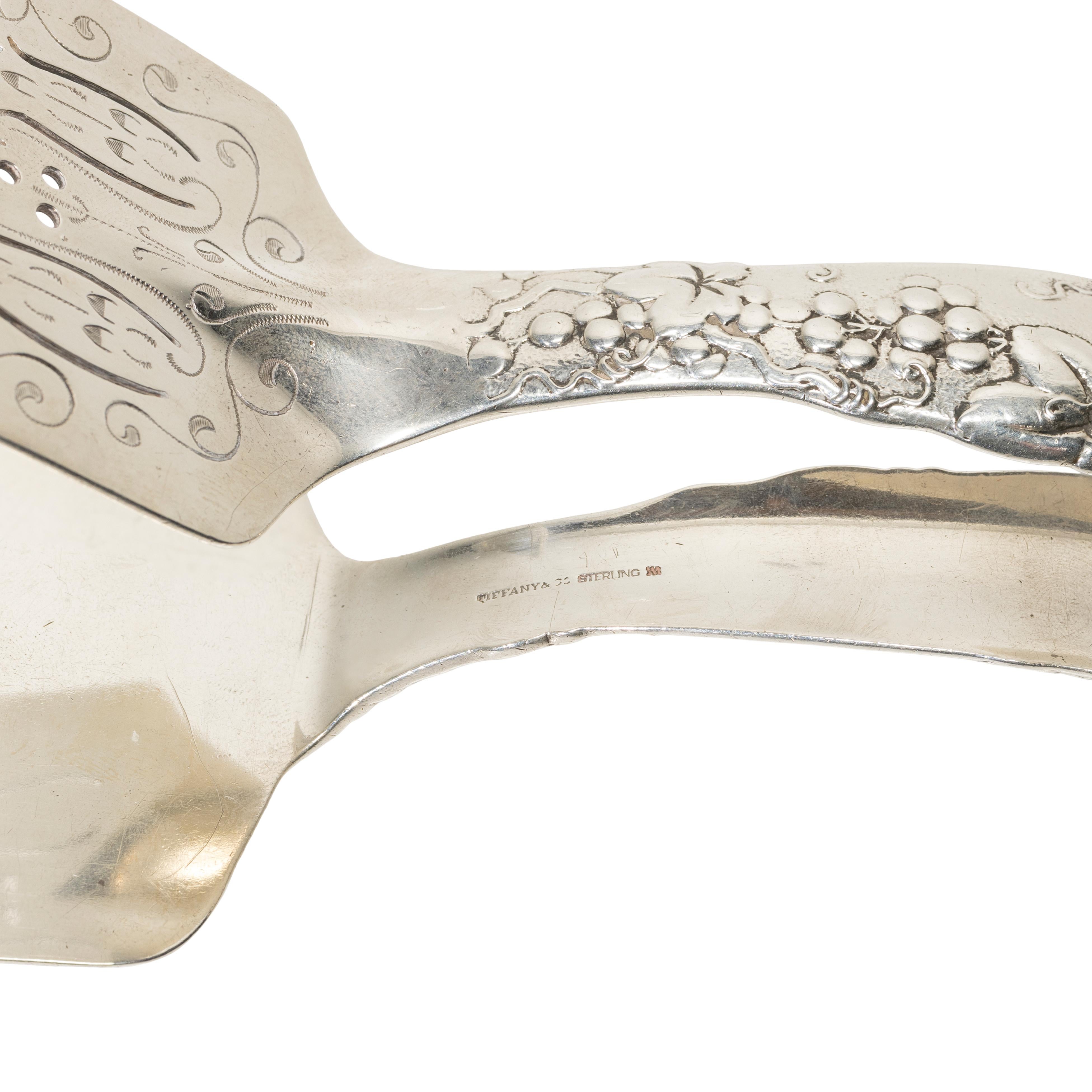 Tiffany & Co. grapevine pattern sterling silver asparagus tongs. New York, c. 1907-1947. Reticulated in etched upper tong, monogrammed. 8