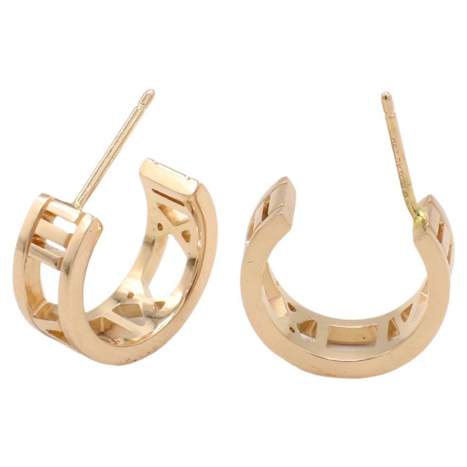Tiffany & Co. Atlas 18 Karat Rose Gold Open Hoop Huggie Earrings 
Metal: 18k rose gold
Weight: 4.88 grams
Width: 5.5mm
Diameter: 13mm
Signed: ©T&Co. Au750

