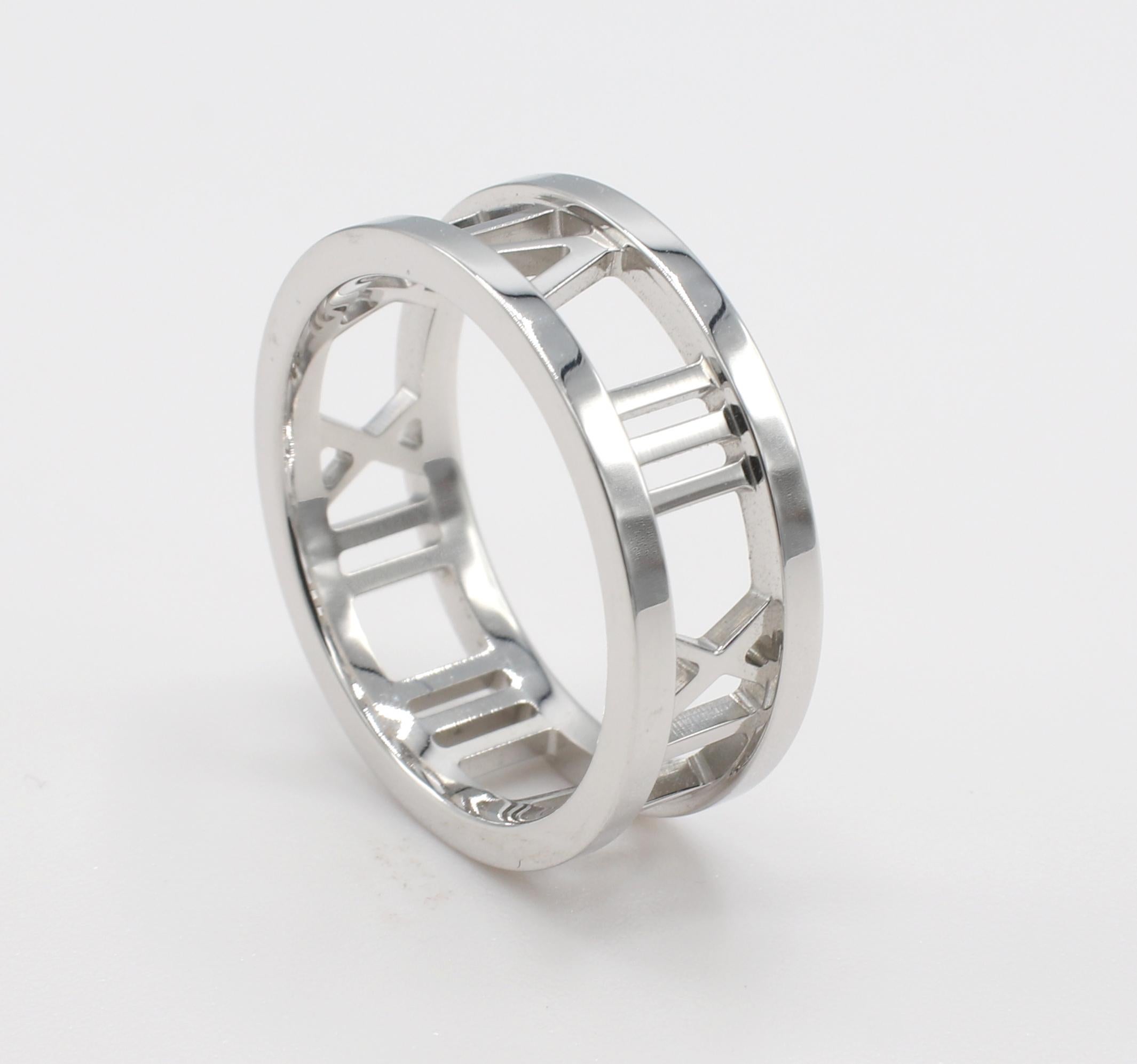 Tiffany & Co. Atlas 18 Karat White Gold 7MM Open Band Ring 
Metal: 18 karat white gold
Weight: 5.73 grams
Width: 7MM
Size: 6.5 (US)
Signed: ATLAS 2003 TIFFANY & CO. 750
