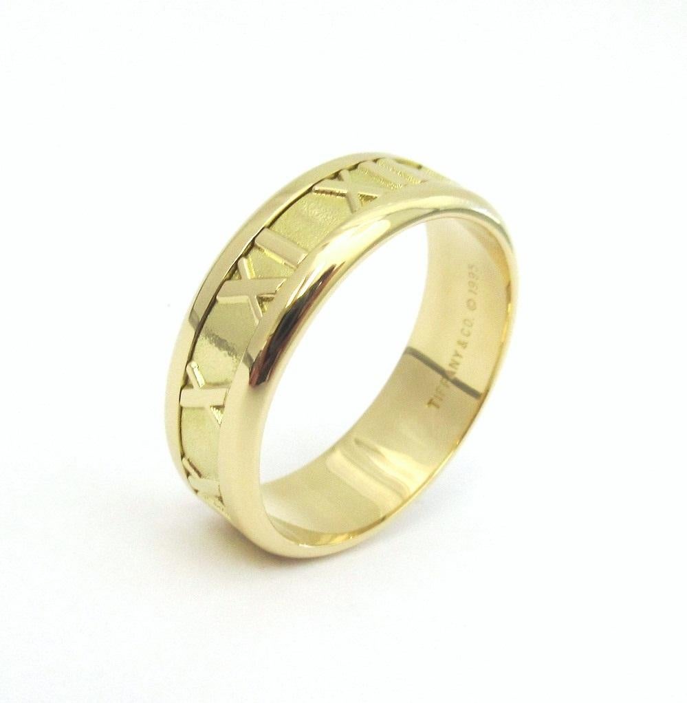 TIFFANY & Co. Atlas 18K Gold 7mm Wide Numeric Ring 10.5

Metal: 18K Yellow Gold
Size: 10.5 
Band Width: 7mm
Weight: 9.20 grams
Hallmark: TIFFANY&CO. © 1995 750 ITALY
Condition: Excellent condition

Limited edition, no longer available for sale in