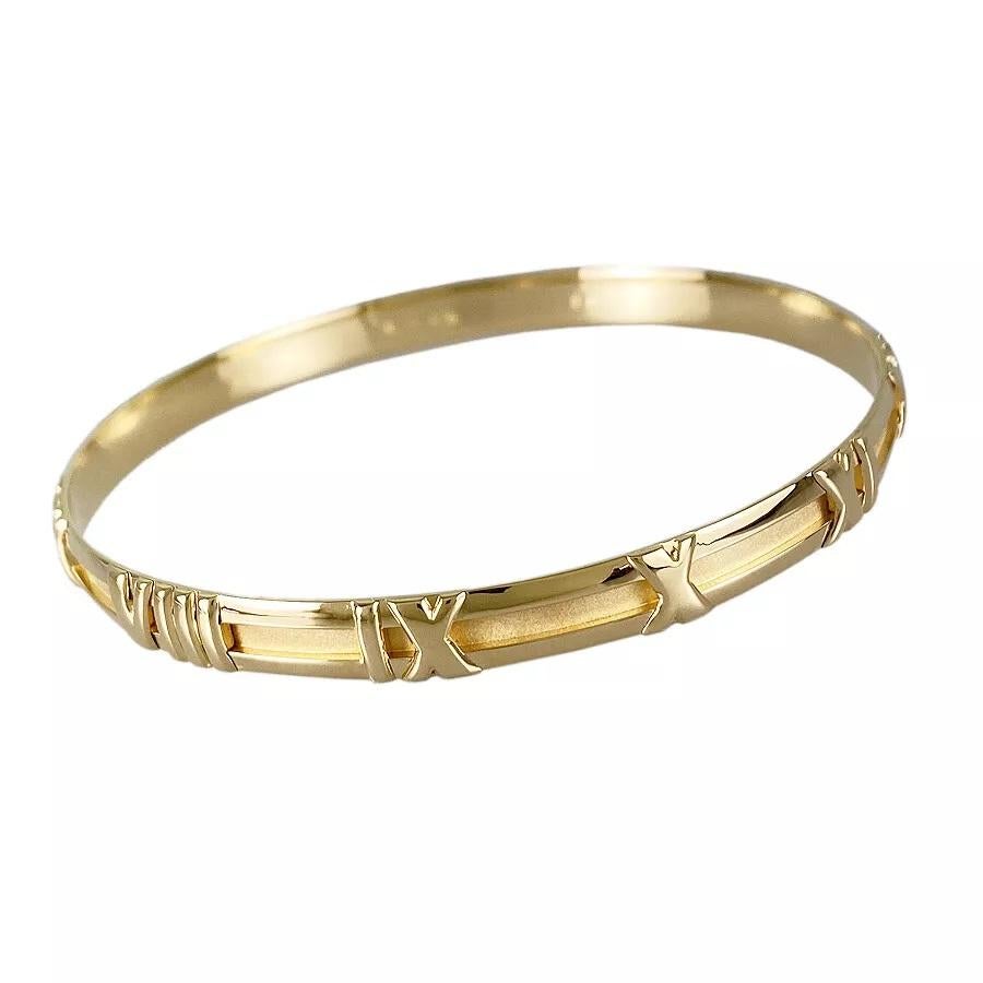 TIFFANY & Co. Atlas 18K Gold Numeric Groove Bangle Bracelet

Metal: 18K Yellow Gold
Weight: 19.70 grams
Measurement: 63mm(2.48